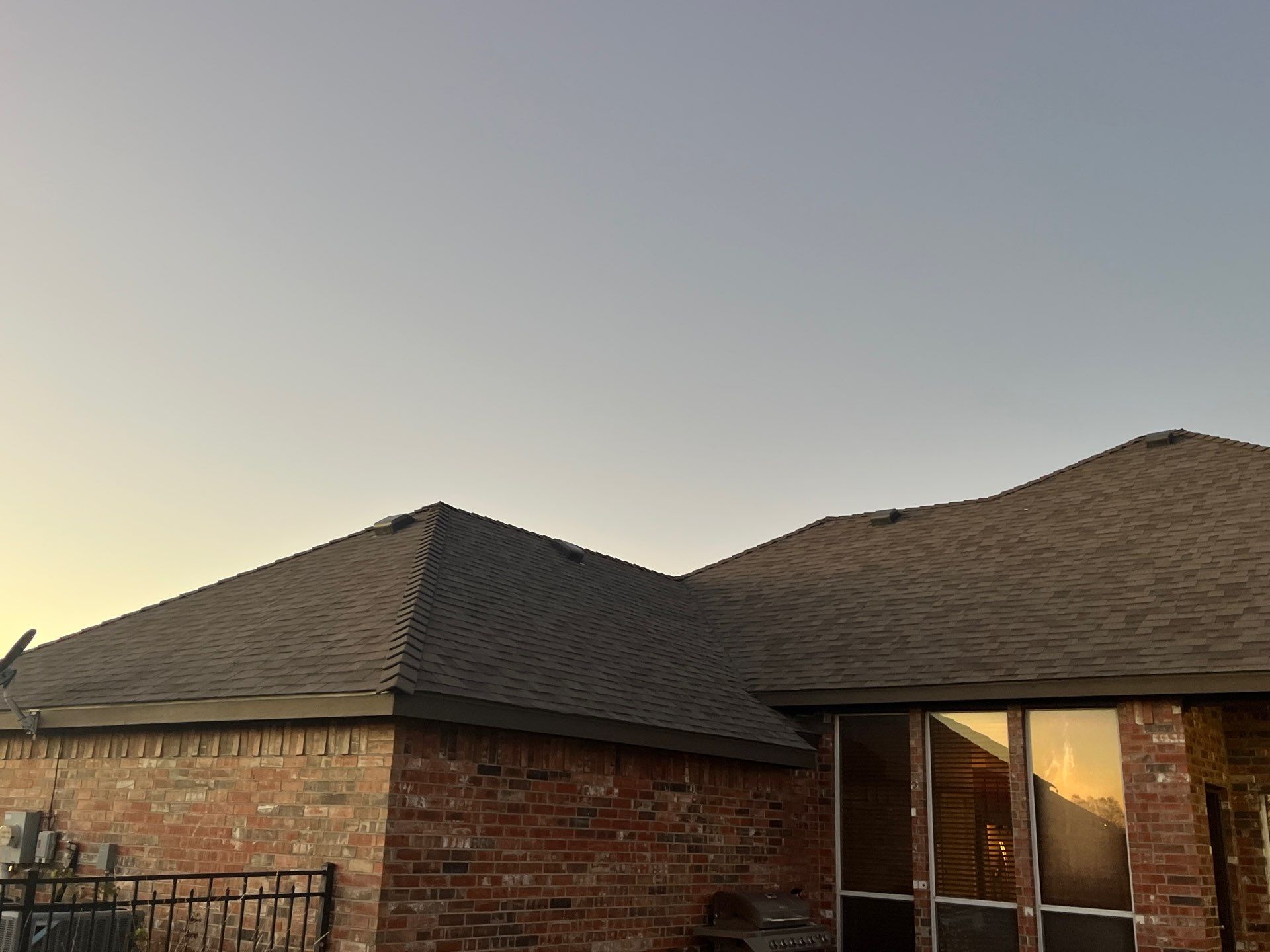 Brick with Malarkey Natural Wood by Tejas Roofworks + Restoration