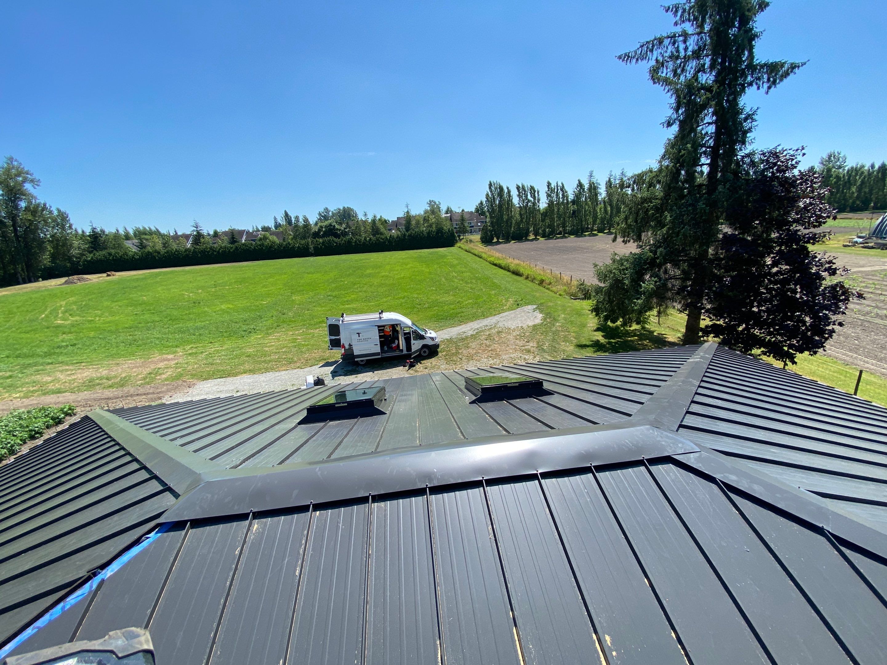Residential Roofing Installation using 12" Prolok metal  by Top Notch Roofing Inc