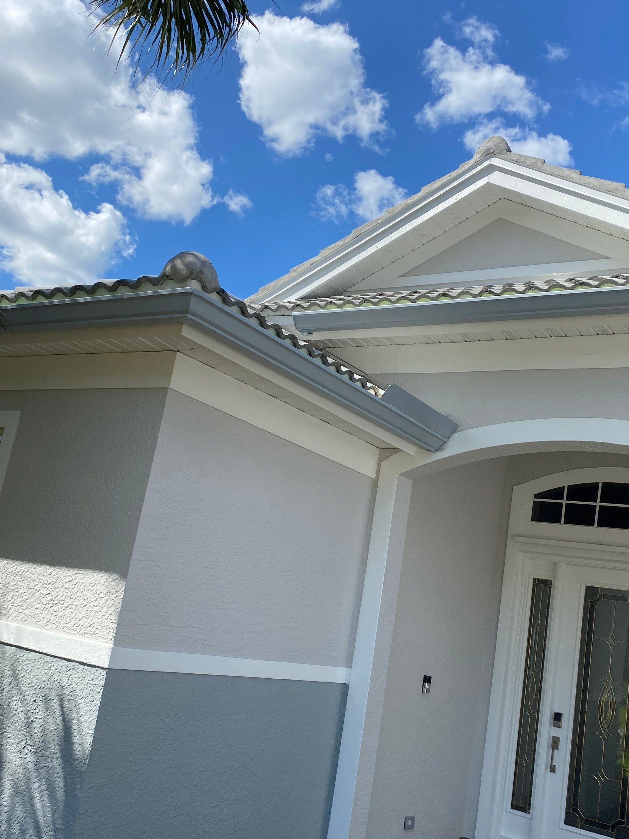 6-inch K-style Seamless Gutters and Splash Guard in Grey Color in Naples FL by Gutter Professors
