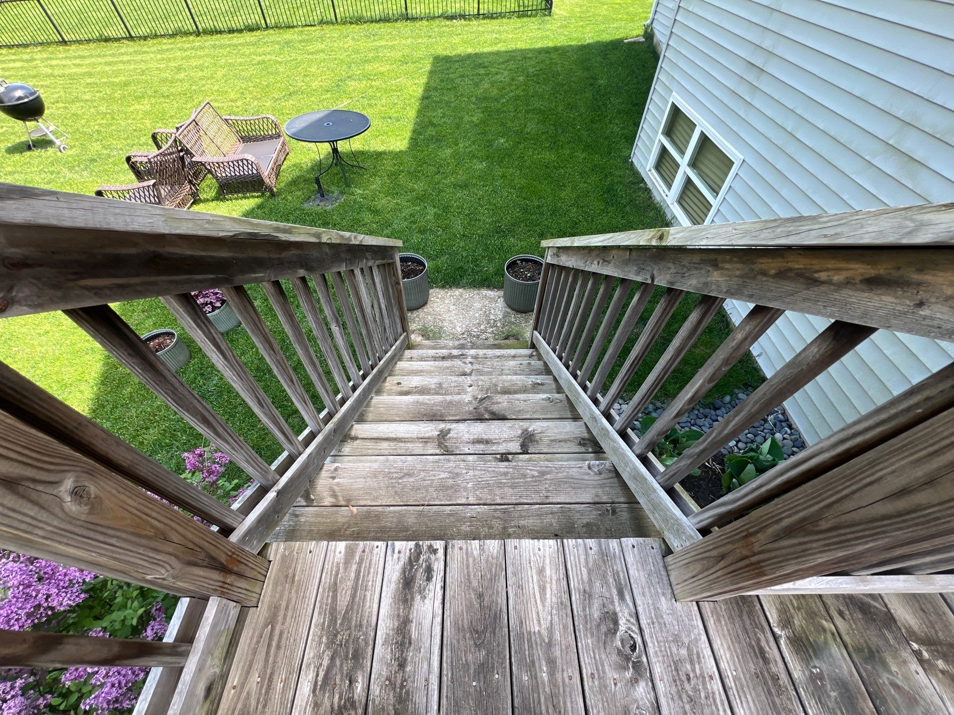wood deck cleaning and staining by Northern Power Washing LLC.