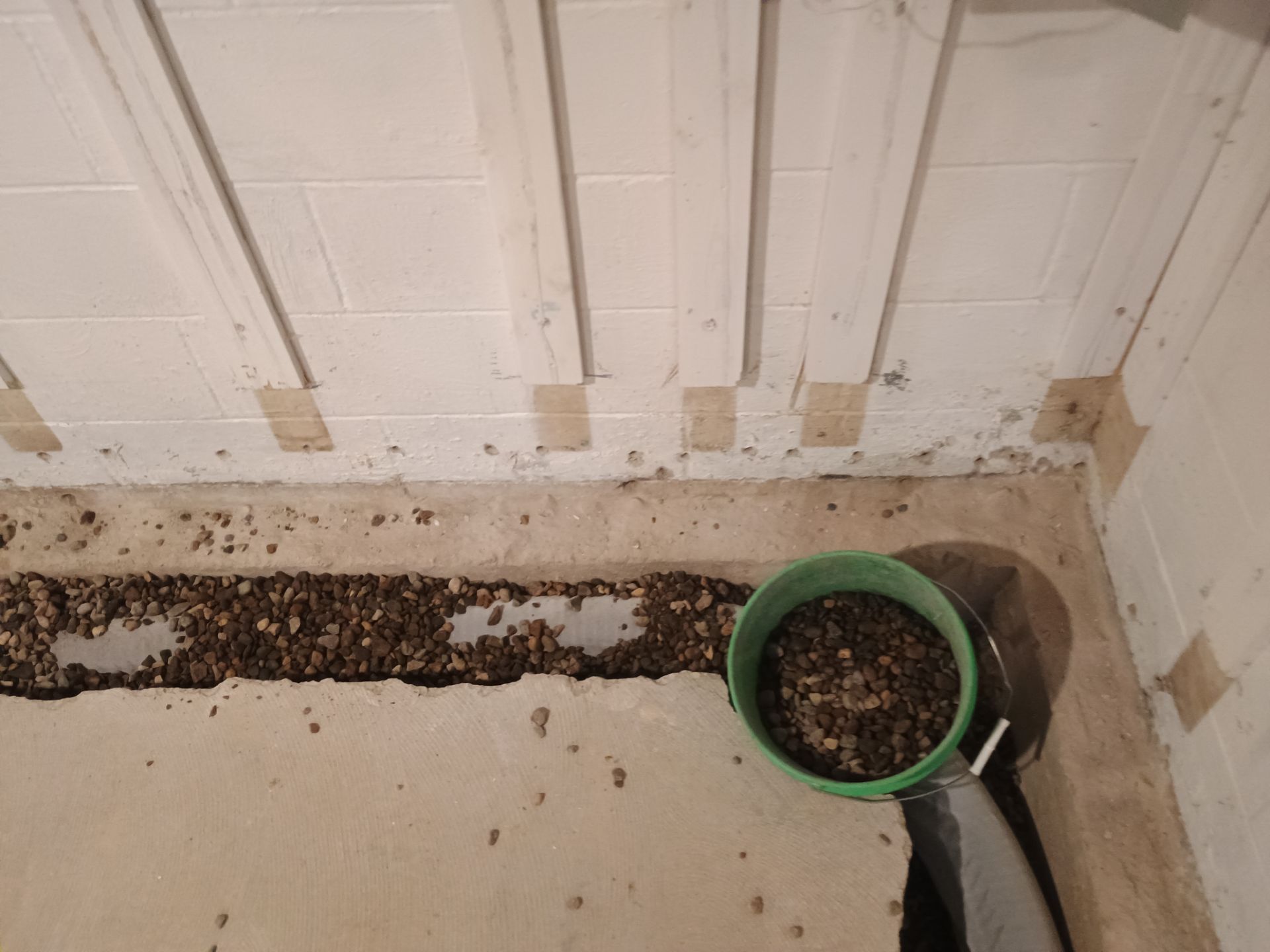 Interior Drain Tile & Buried Discharge in St. Anthony, MN by Waterproofing Northeast
