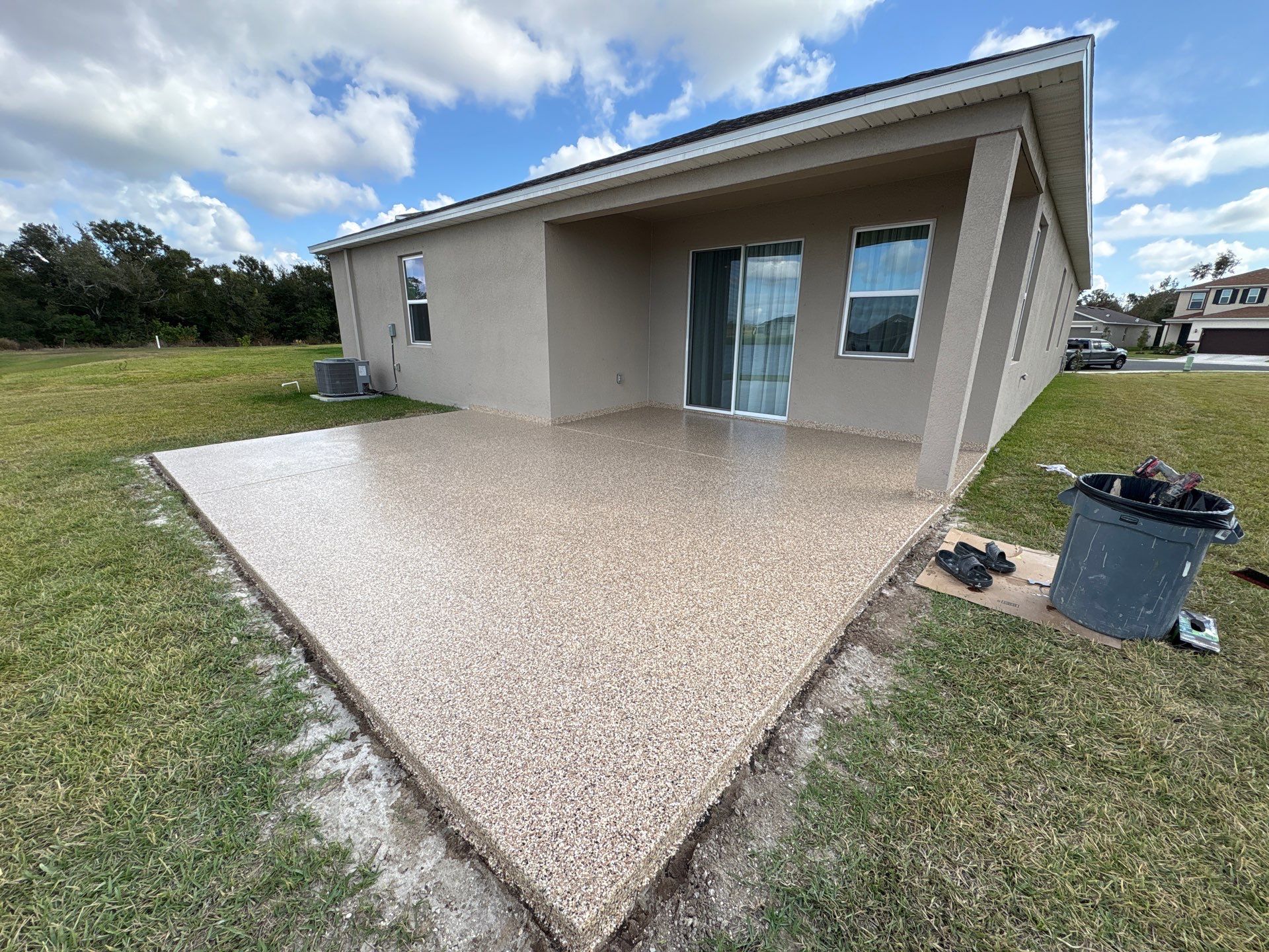 Outdoor Living Upgrade: 'Outback' Flake System for a Premium Patio Finish by Performance Floors & Coating