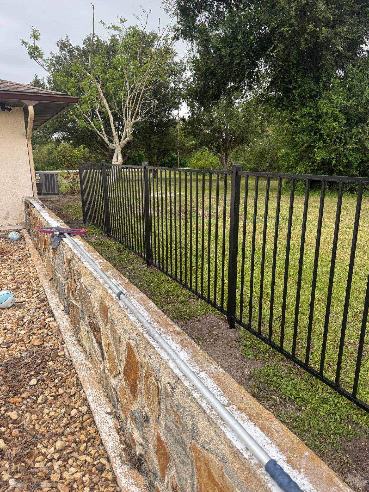 Black Aluminum Pool Safety Fence Installation in Punta Gorda by True Fence LLC