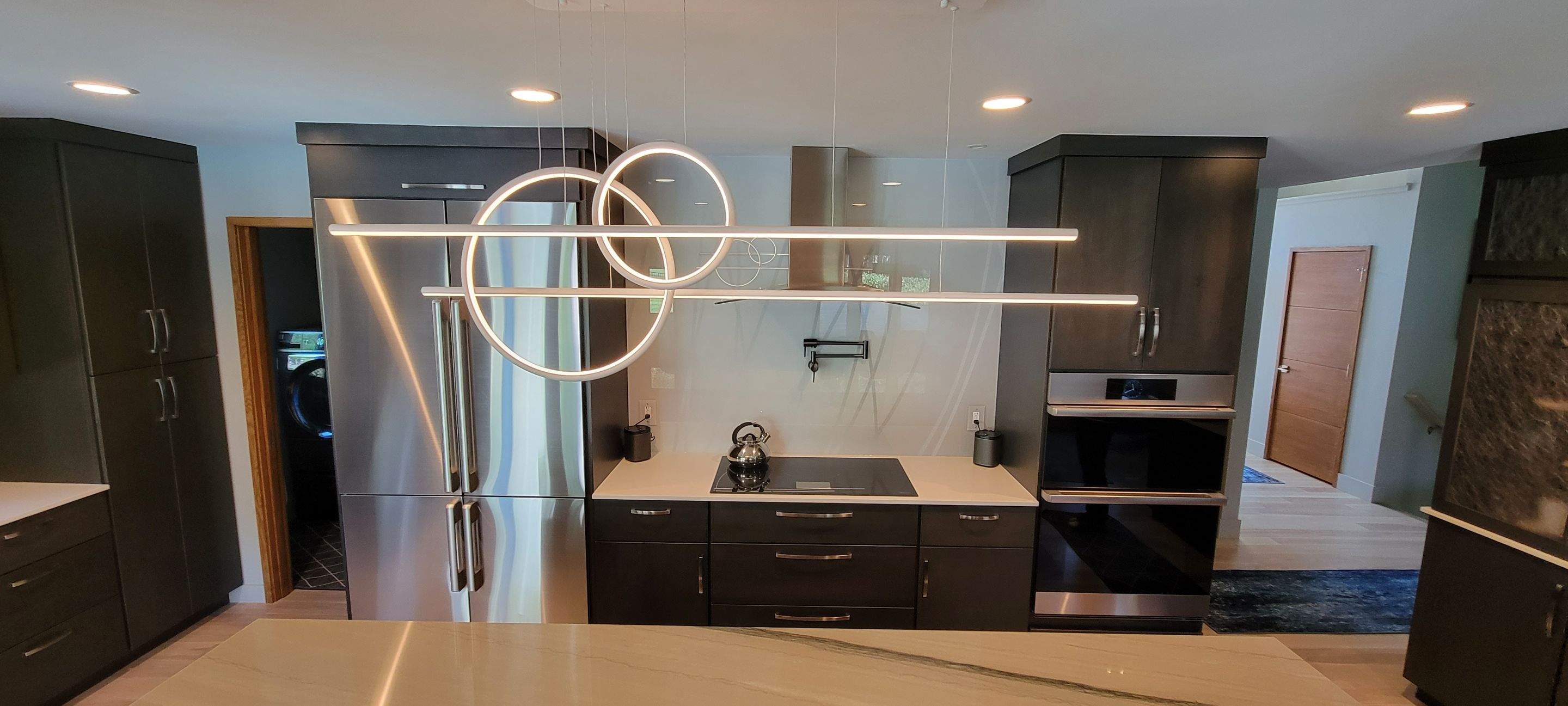 Kitchen Remodel using IMAGIO Misty Curves Solid Glass Backsplash by IMAGIO