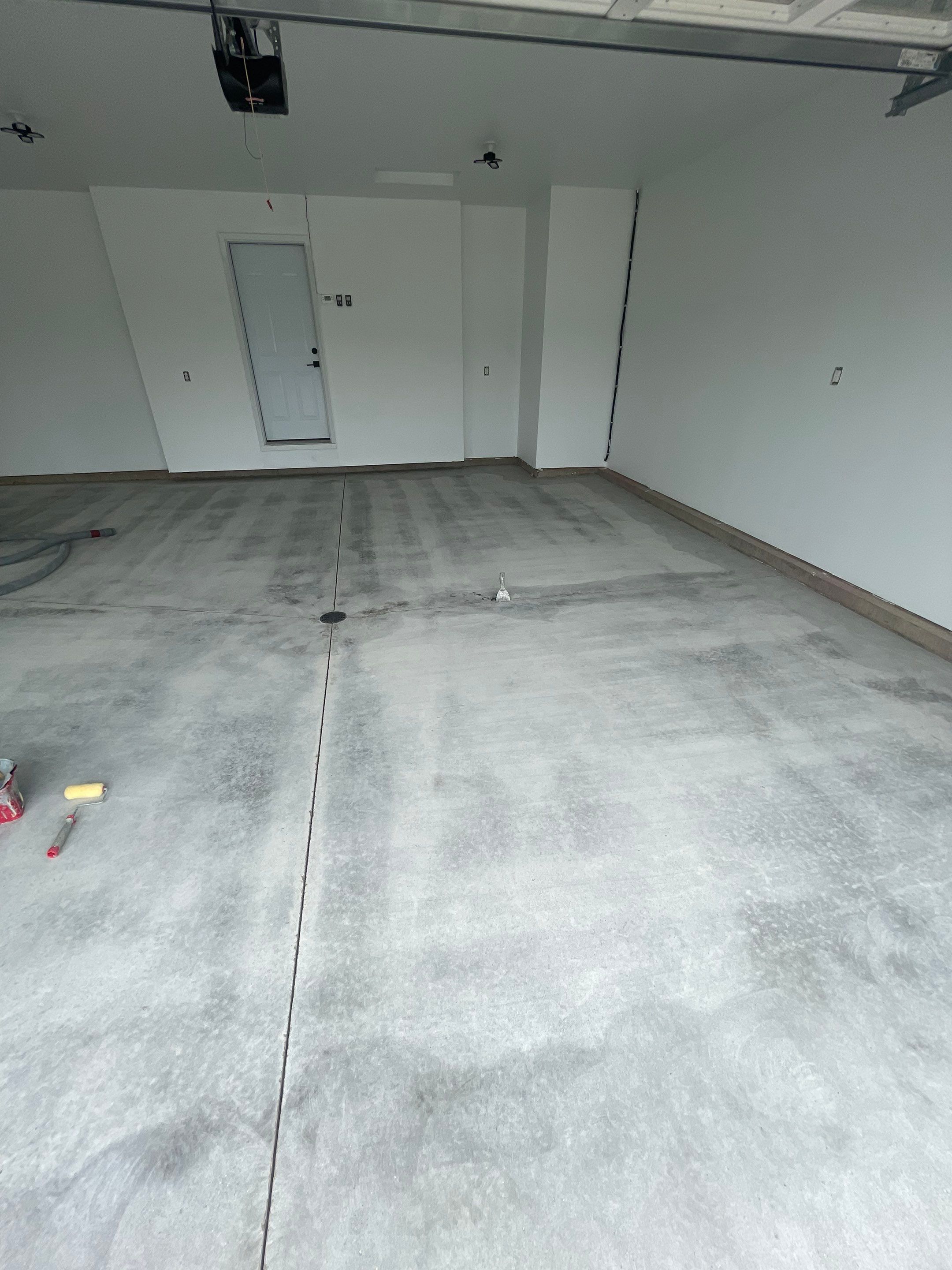 Grey Flake Epoxy Garage Floor Coating in Sioux Falls by Select Painting, Coatings & Garage Cabinets
