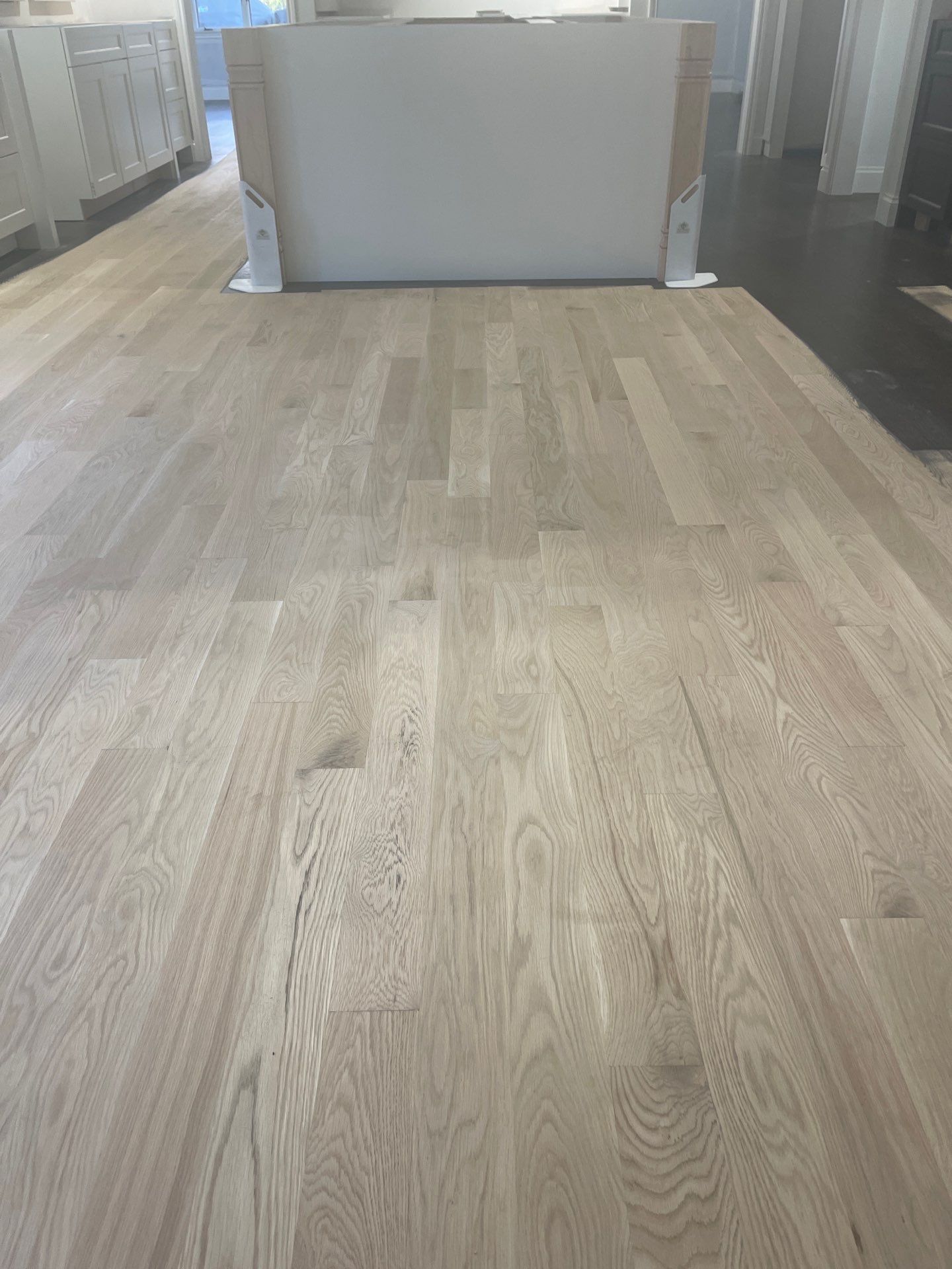 New Flooring installation using 4" White oak select grade plain sawn Ebony Stain by Ann Arbor Hardwoods