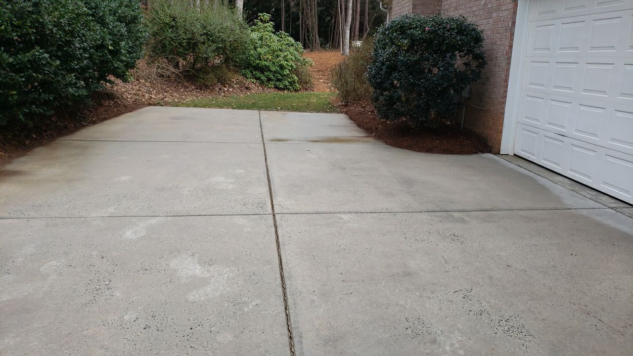 Driveway Clean using cleaner by Power Wash Masters LLC
