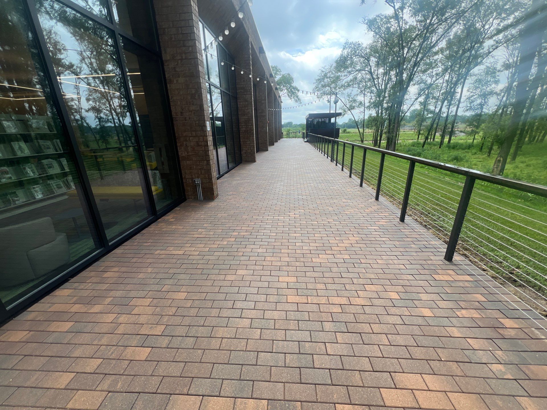 Brick paver repair, cleaning, sealing and poly sanding by Northern Power Washing LLC.