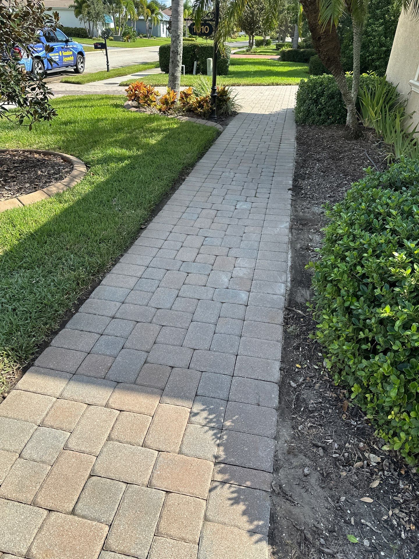 Paver Driveway, Entryway, Sidewalk, and Street Curbing Cleaning in Winding River Community, Bradenton, FL by Sunshine AquaWash