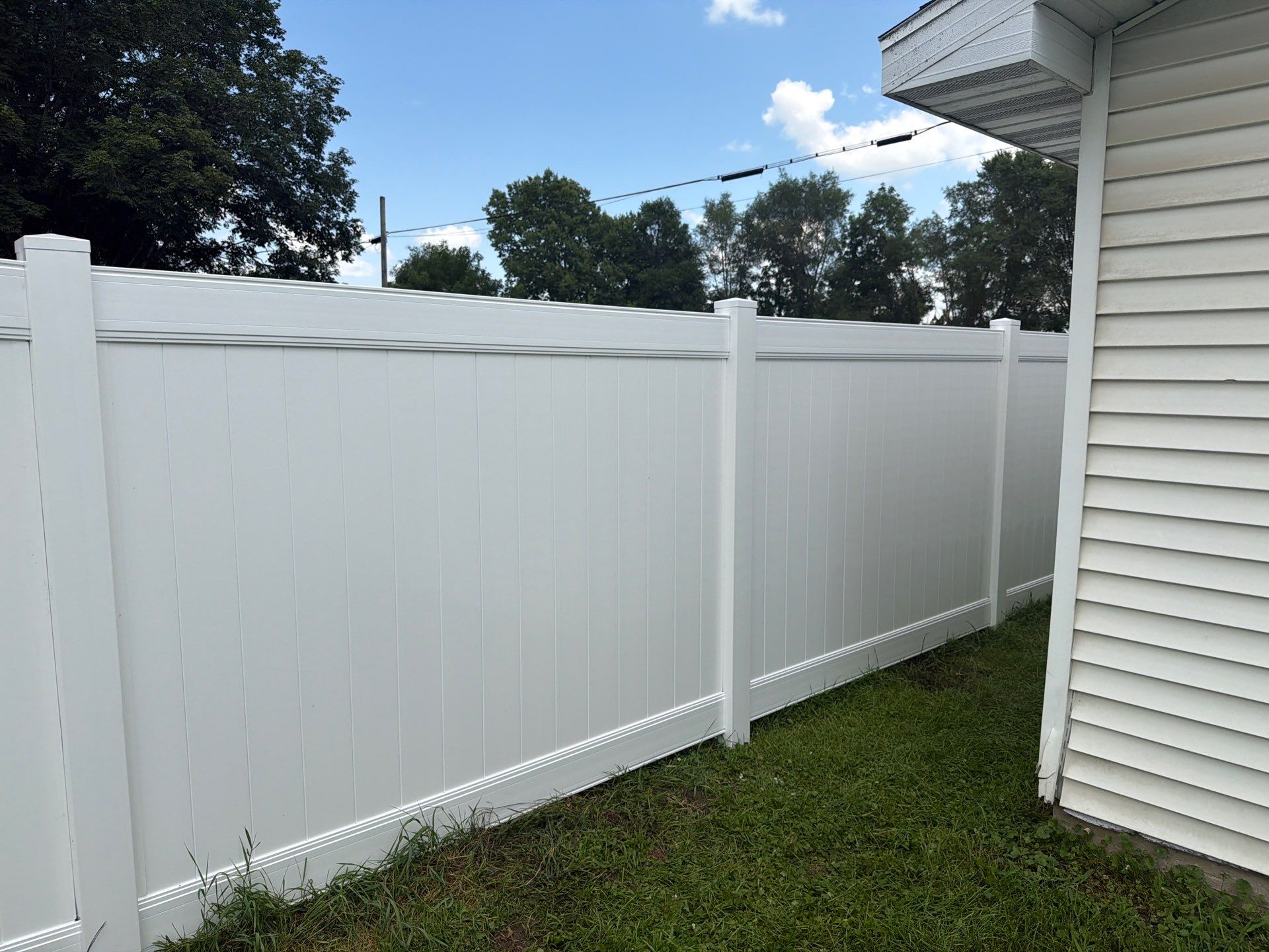 White Vinyl Privacy Fence Installation in Waterloo, Iowa by Perfect Picket Fence and Stain