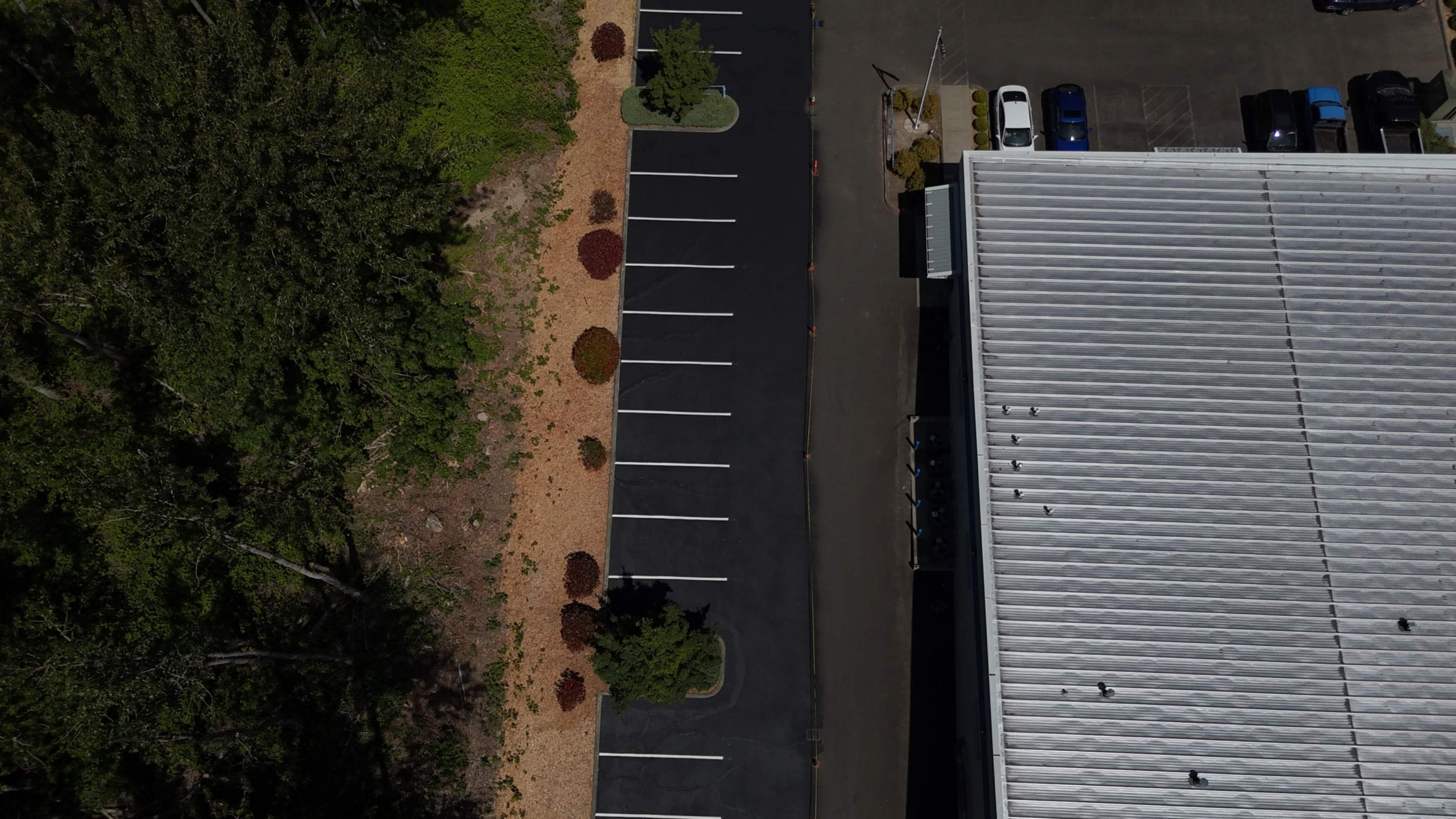 King Machine Business Parking Lot Sealcoat Overlay | Mukilteo by Jireh Asphalt & Concrete Inc 