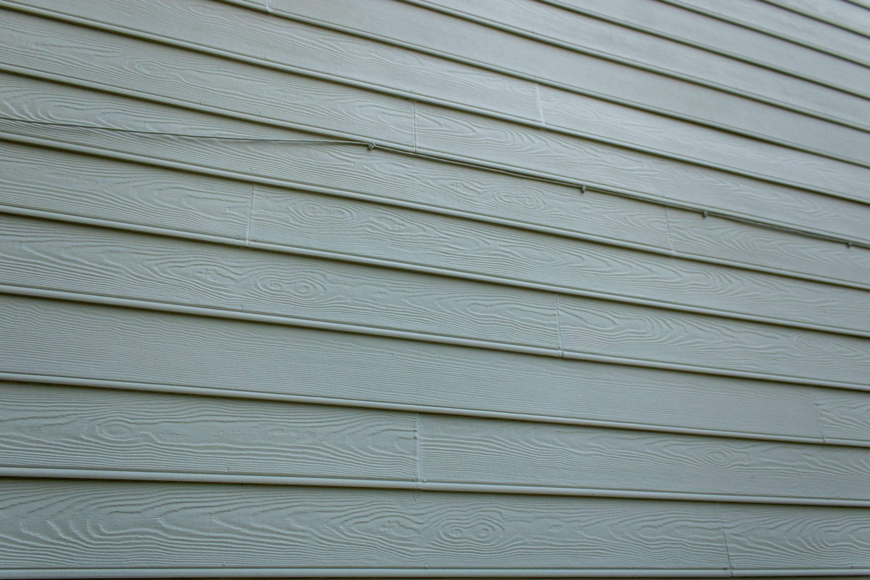 Alpharetta, GA Partial Siding Replacement, Porch Stain, and Exterior Painting by Nelson Exteriors 
