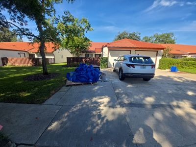 Residential Tile Roof Replacement and Gutter Installation in Winter Park by Pinnacle Roofing Group