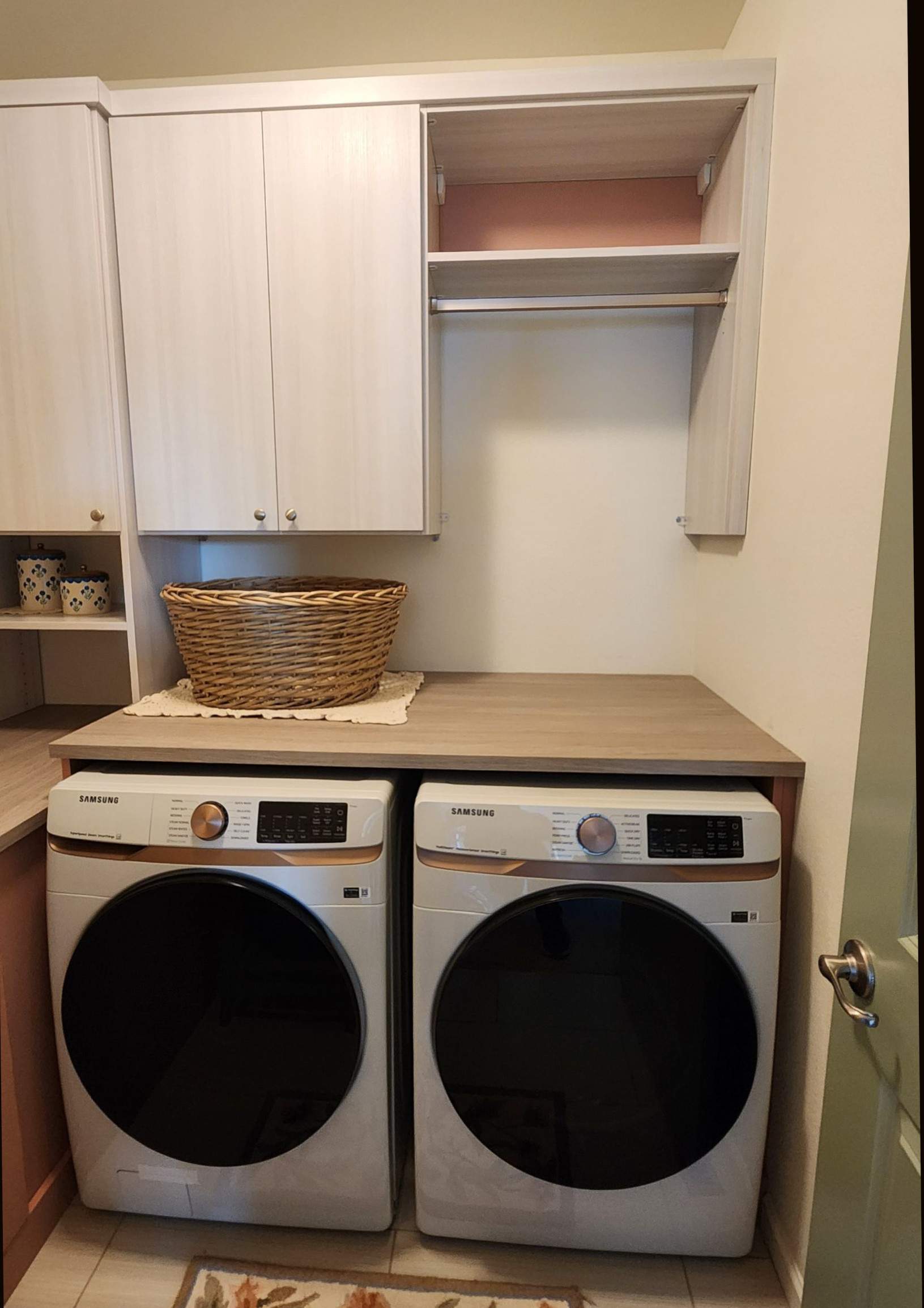 Laundry Room designed to match closets by Concept 32, Inc.