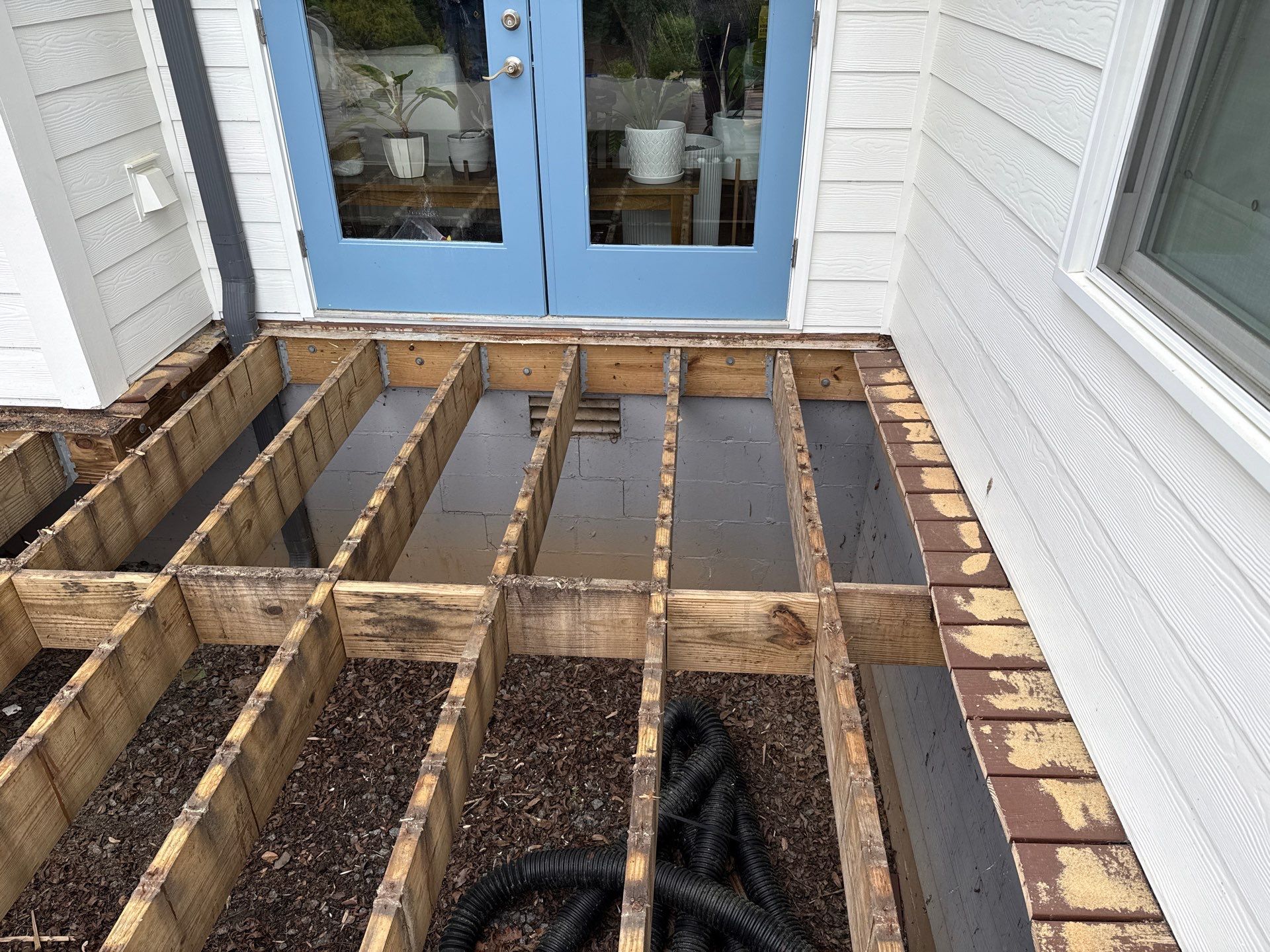 Deck Resurface with Glass Paneling and Deckorators Voyage Series Products by Nelson Exteriors 