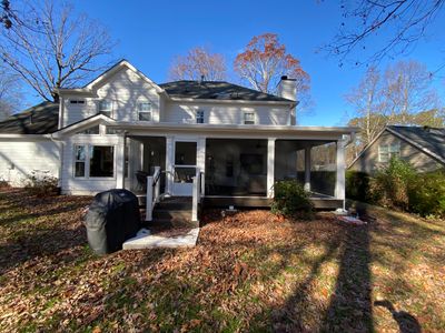 Custom Screened Porch with Beadboard Ceiling and Composite Decking
