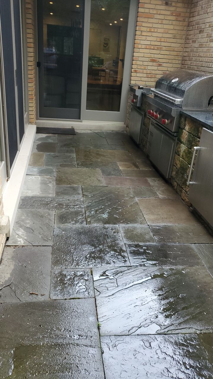 Bluestone patio cleaning by Northern Power Washing LLC.