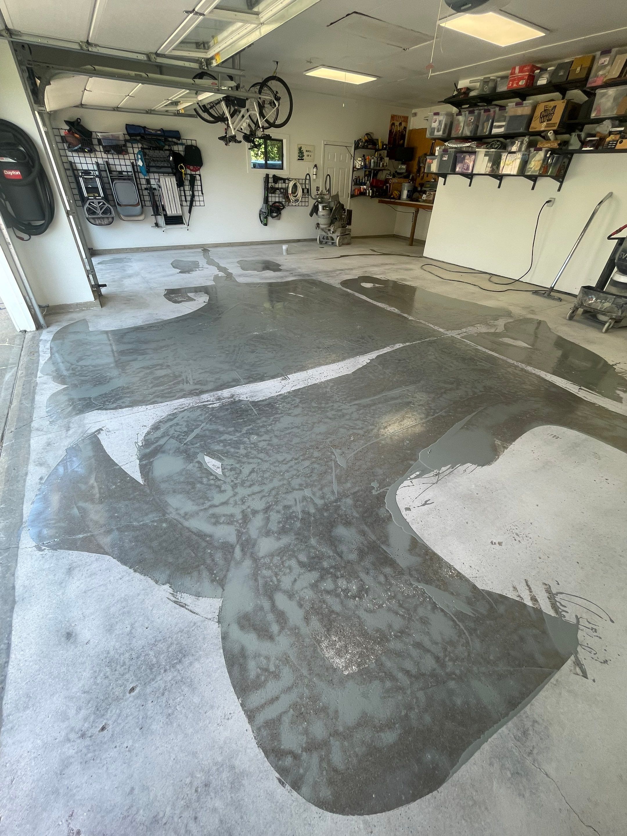 Feather Grey Garage Floor Coating Installation in Sioux Falls by Select Painting, Coatings & Garage Cabinets