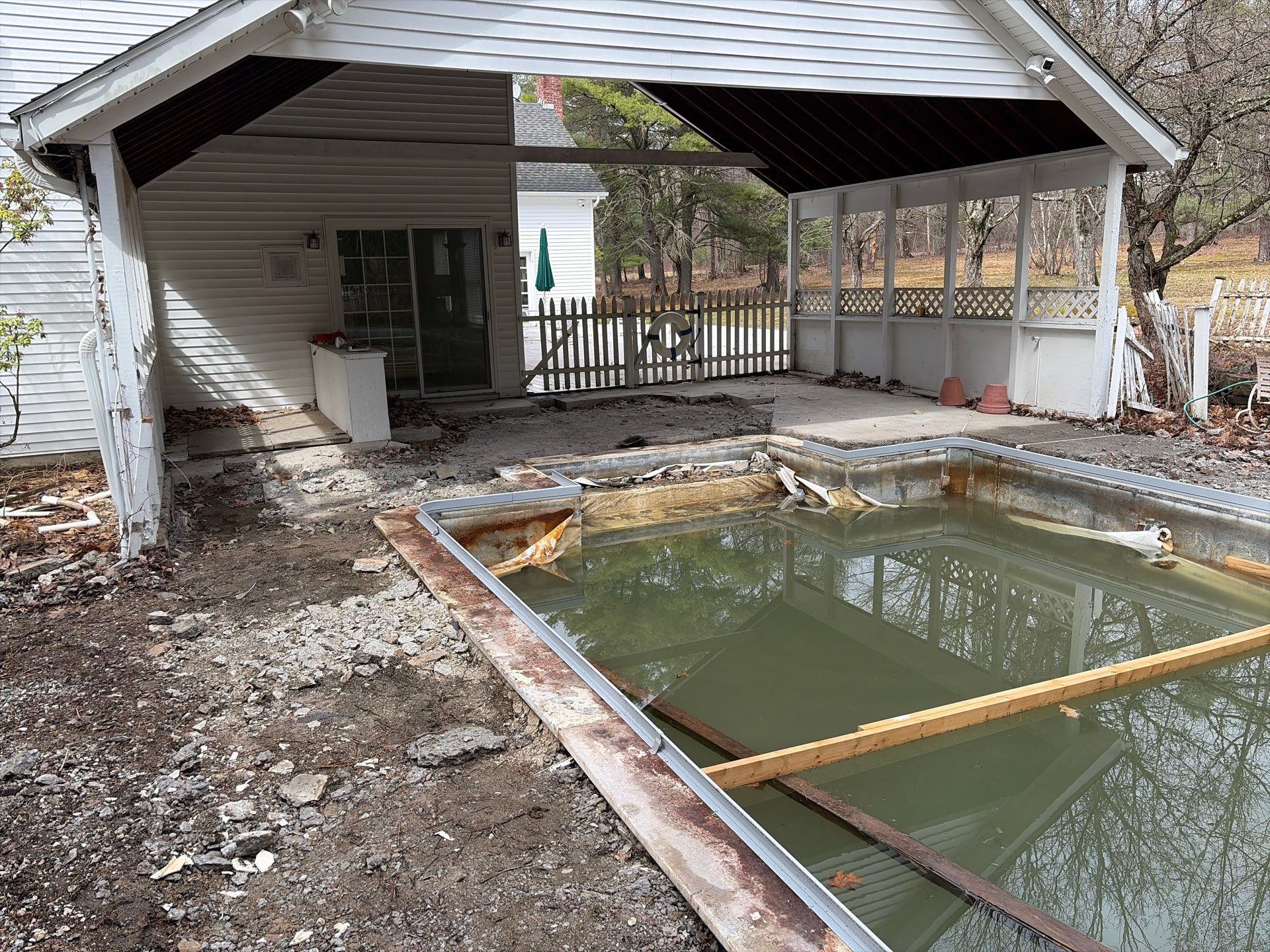 In-Ground Swimming Pool Renovation and Concrete Decking in Old Chatham by Cypress Pools and Spas