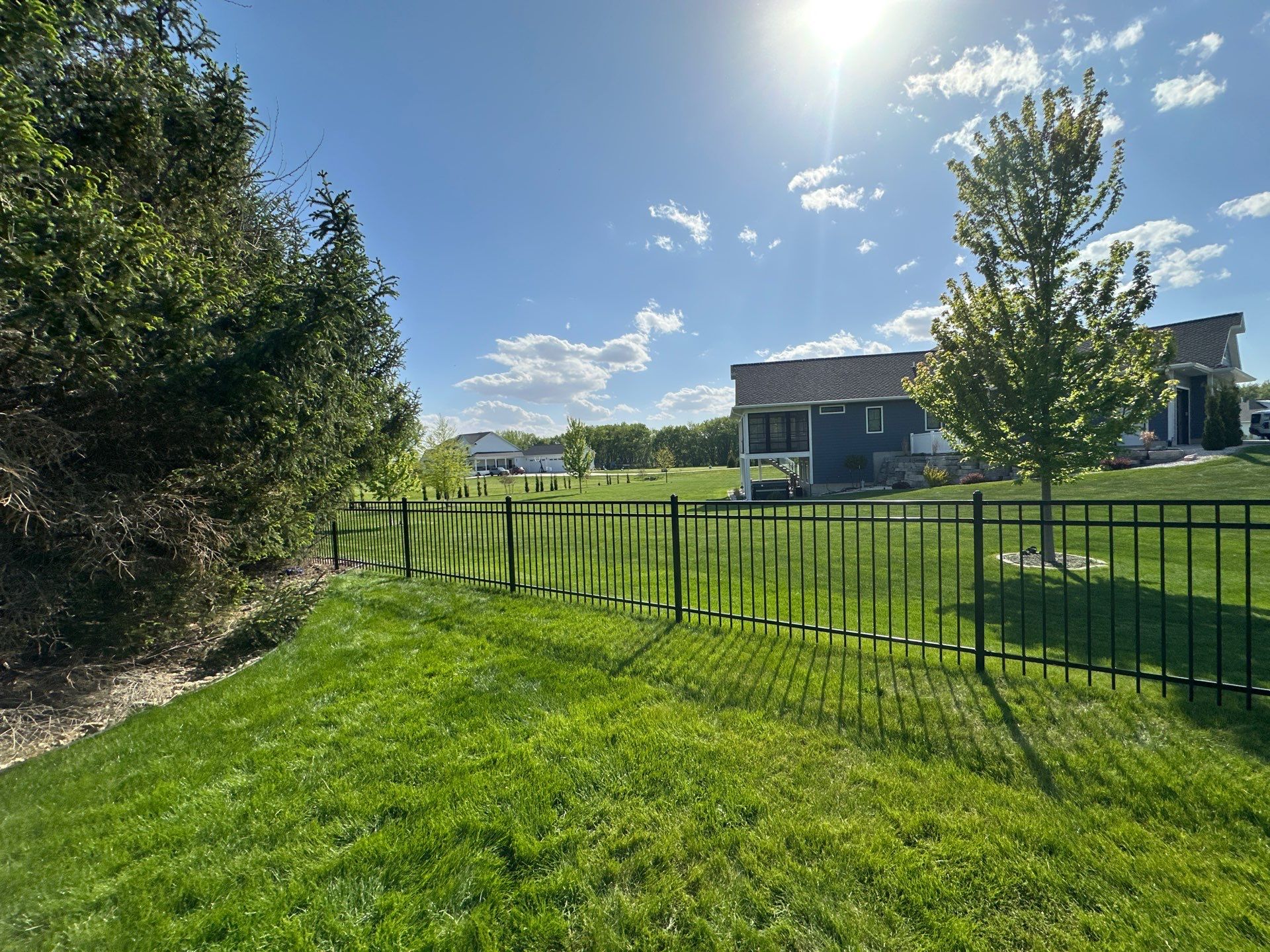 Black Ornamental Metal Picket Fence Installation in Waterloo by Perfect Picket Fence and Stain