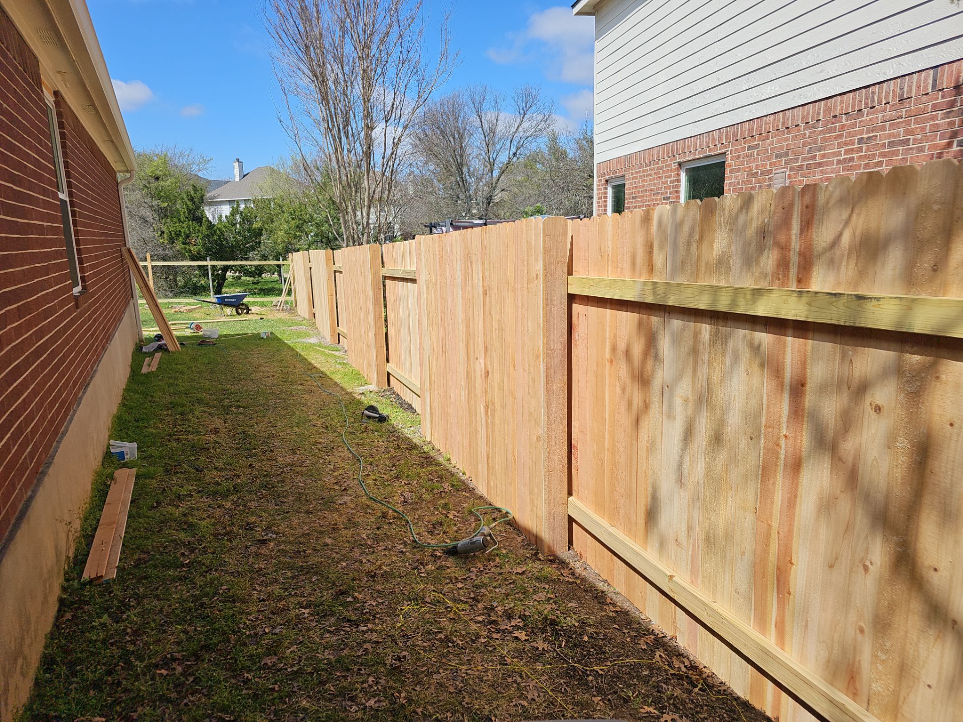 Fence Installation using Cedar Pickets by DeZign Roofing & Exteriors
