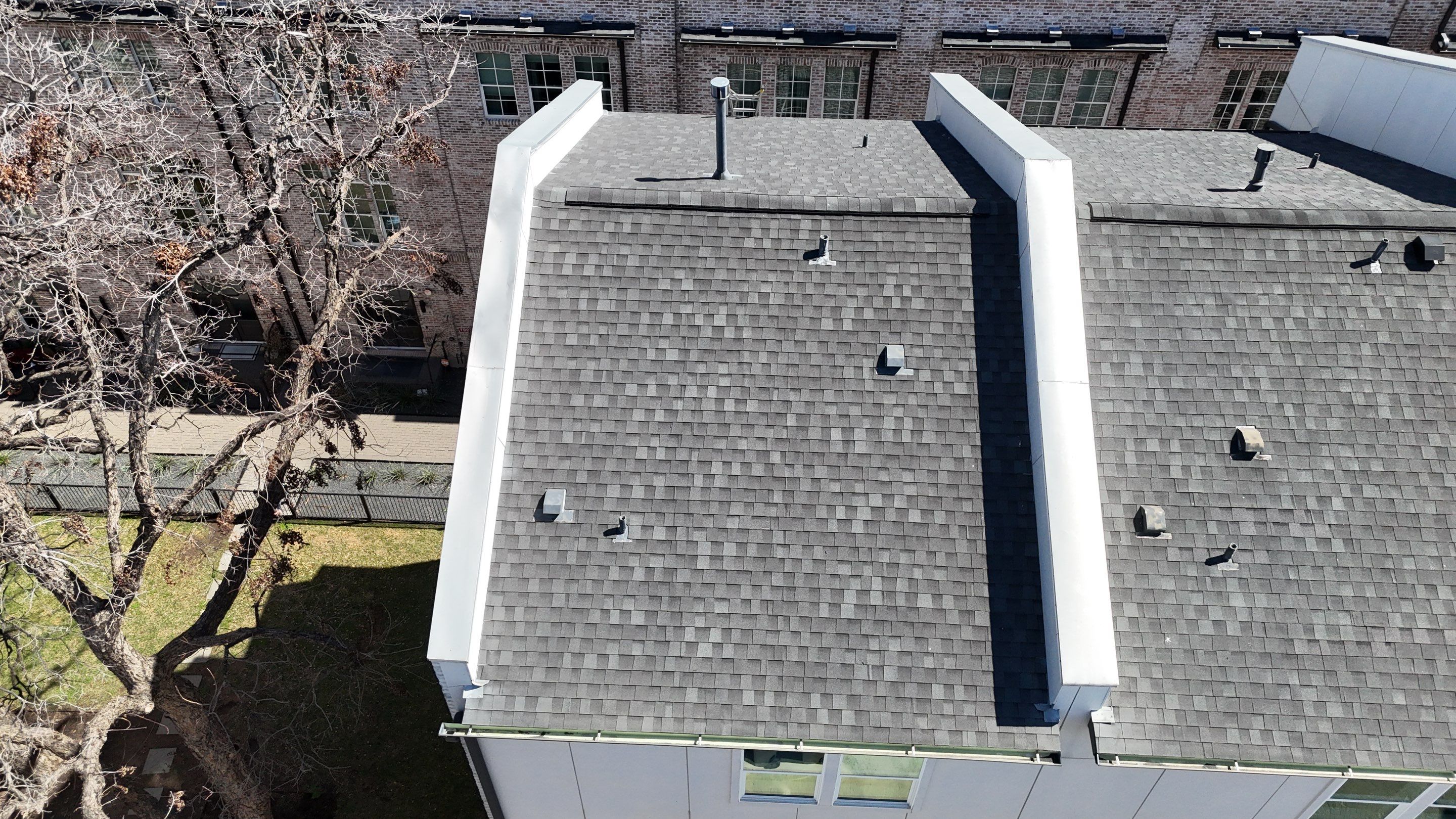 Residential Roof Replacement using TAMKO -  Stormfighter IR - Rustic Black by Action Exteriors Austin