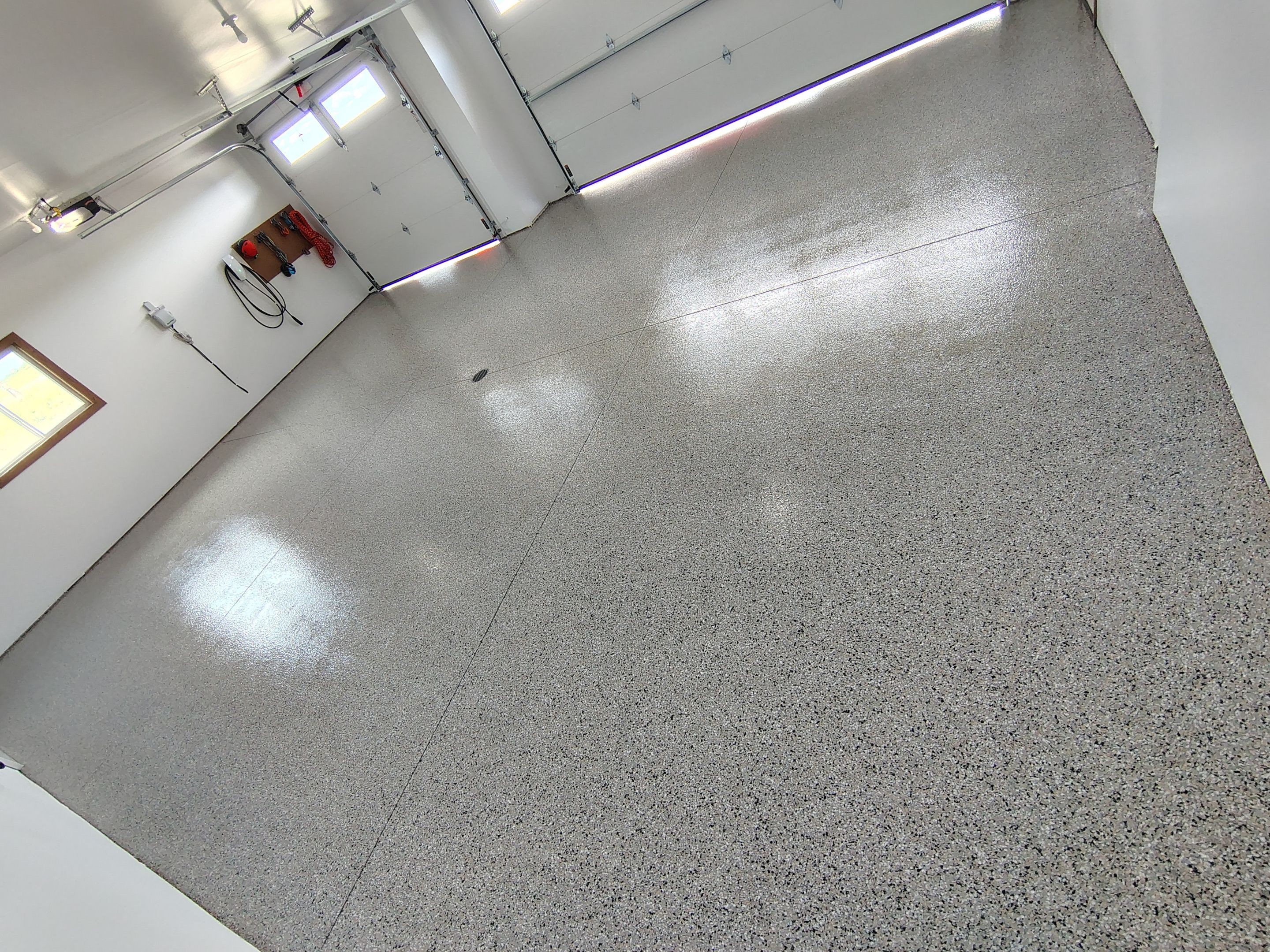 Gray and White Speckled Epoxy Garage Floor Coating in Tea by Select Painting, Coatings & Garage Cabinets