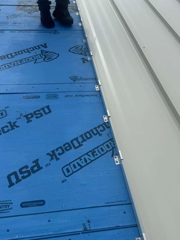 Residential Roofing Installation using 1.5'' Mechanical Seam by BLUES BROTHERS ROOFING