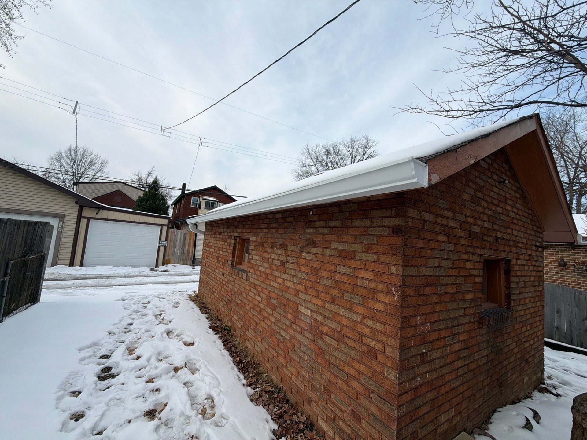 Holly Hills Storm Restoration: Soffit Repair & 6" Gutter Upgrade (South St. Louis) by Acute Roofing And Exteriors