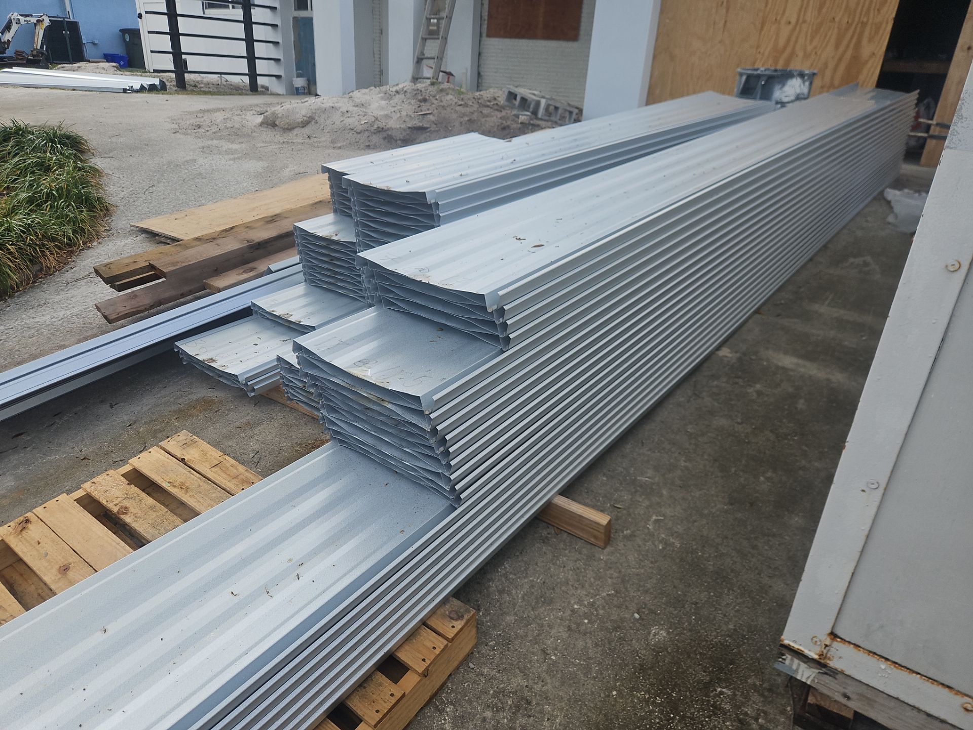 Residential Roofing Installation using 1" Nail strip metal roof by BLUES BROTHERS CONSTRUCTION CORP