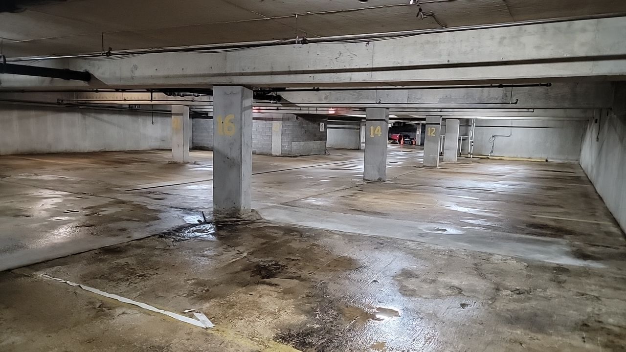 Parking garage using Hot water by Northern Power Washing LLC.