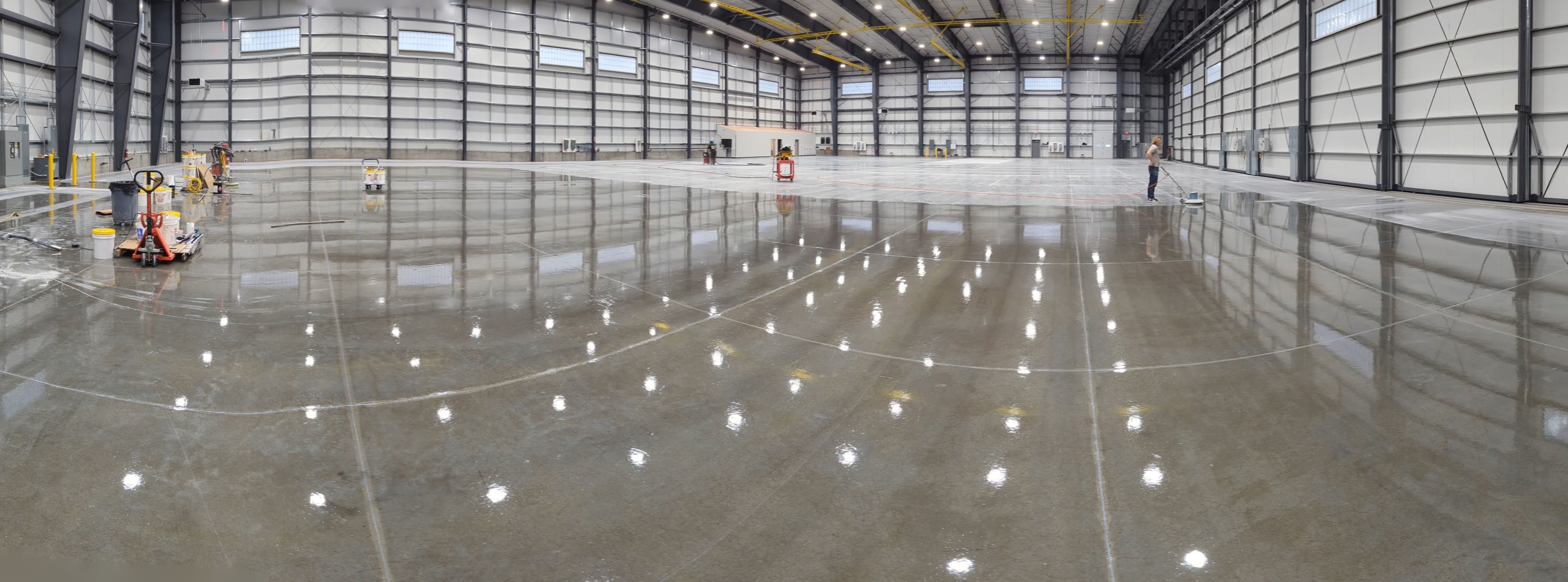 Airplane Hanger using Light Grey Commercial Penntek Epoxy by Croc Coatings, LLC