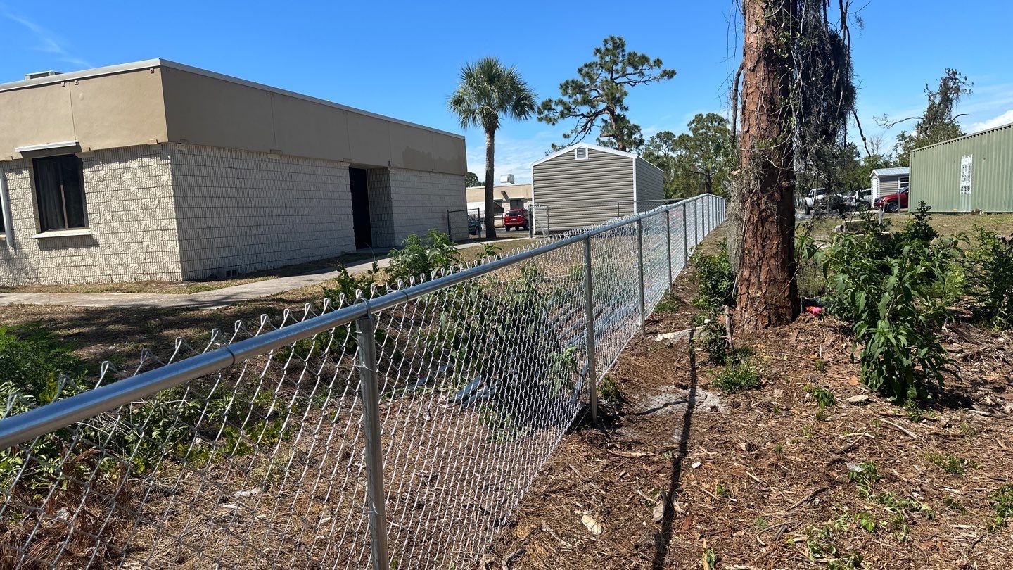 Commercial Chainlink and Vinyl Fence With Aluminum Framed Gates On Dumpster Enclosure by Asap fence and gates, LLC