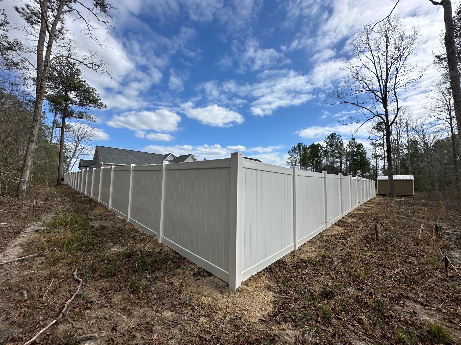 White Vinyl Privacy Fence Installation in Cameron, NC by Superior Fence and Rail