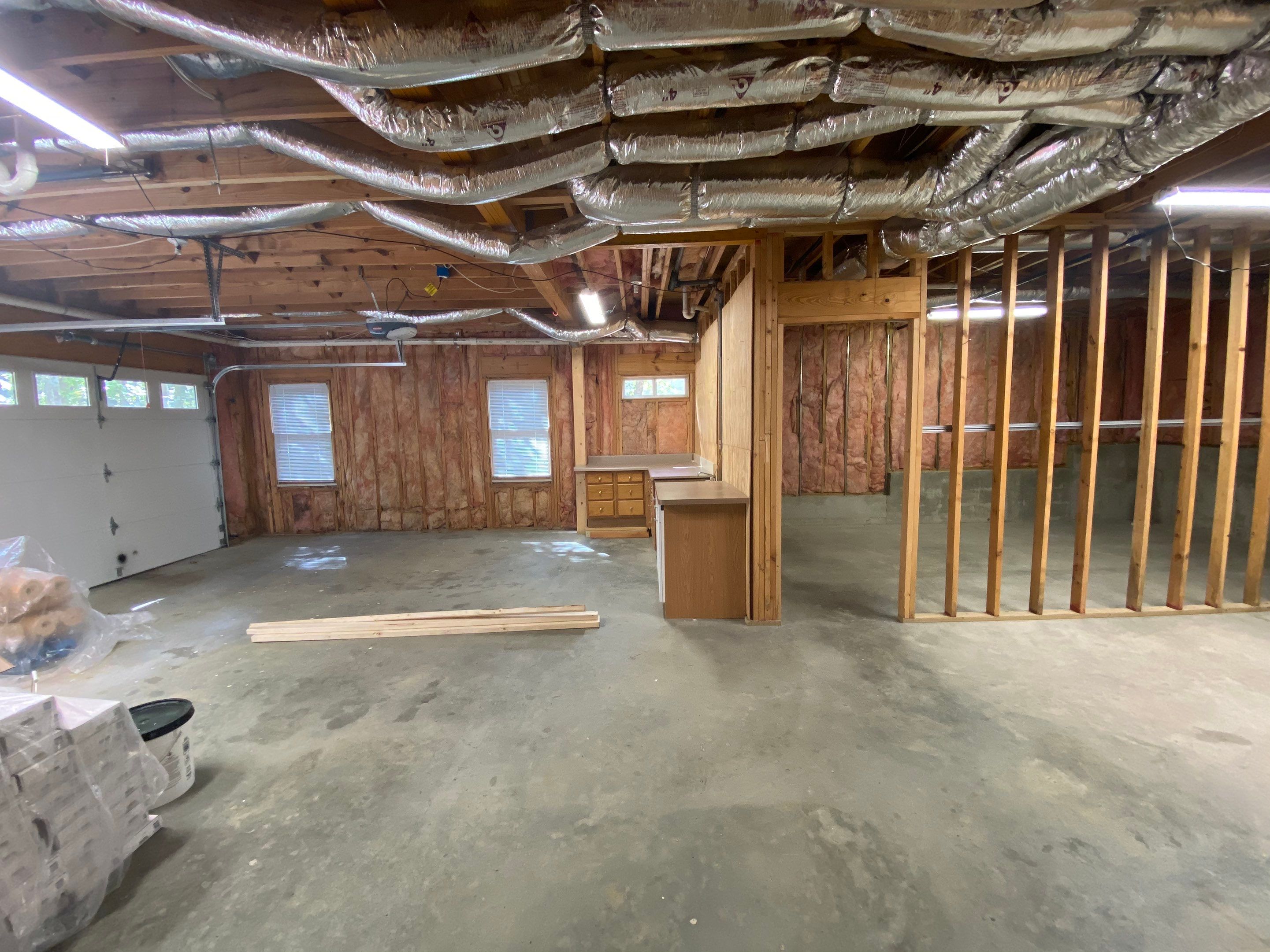 Acworth Basement Transformation With Wet Bar and Stone Fireplace by Swift Home Renovations
