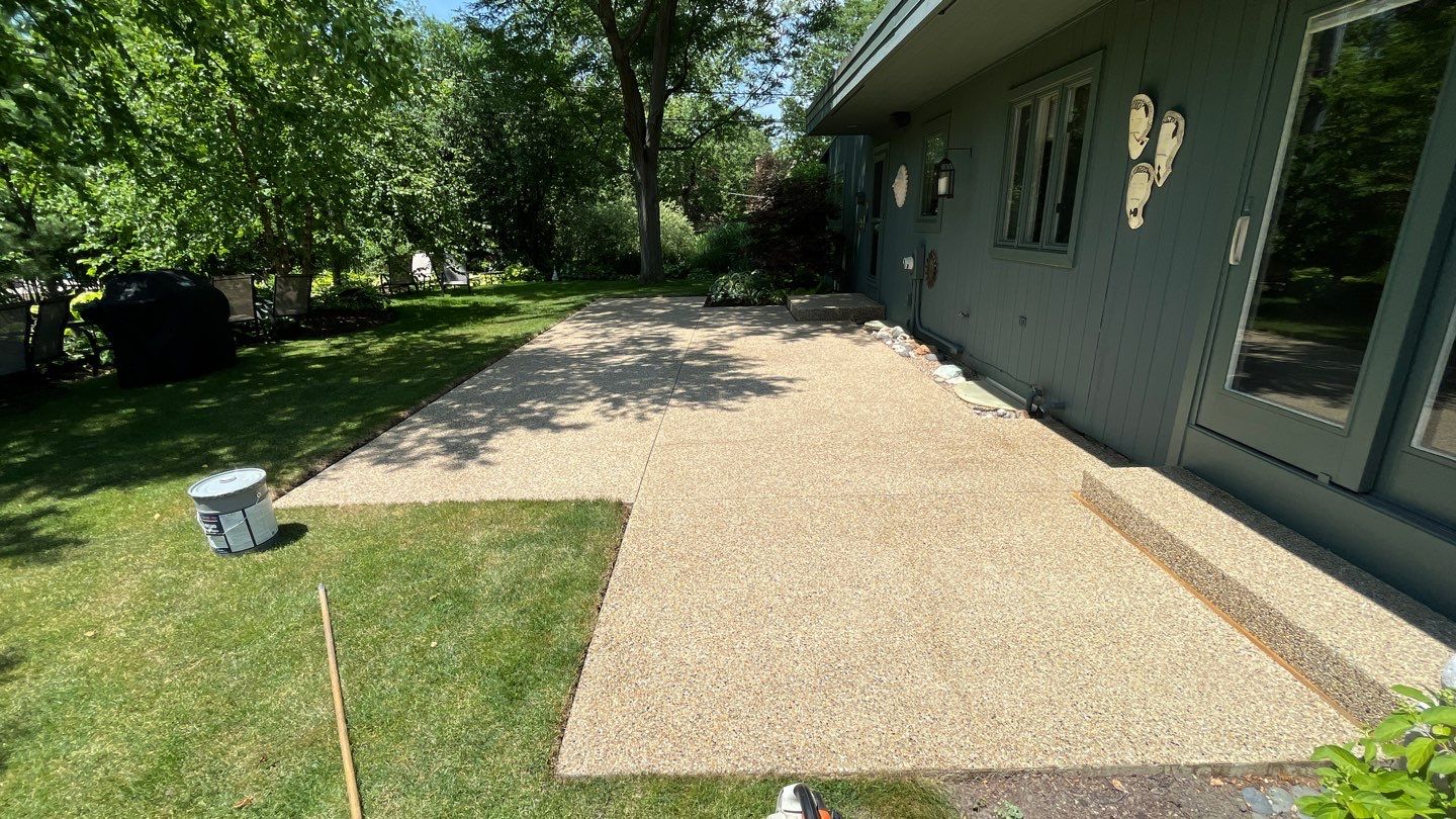 Aggregate concrete cleaning and sealing using Surebond SB-9000 by Northern Power Washing LLC.