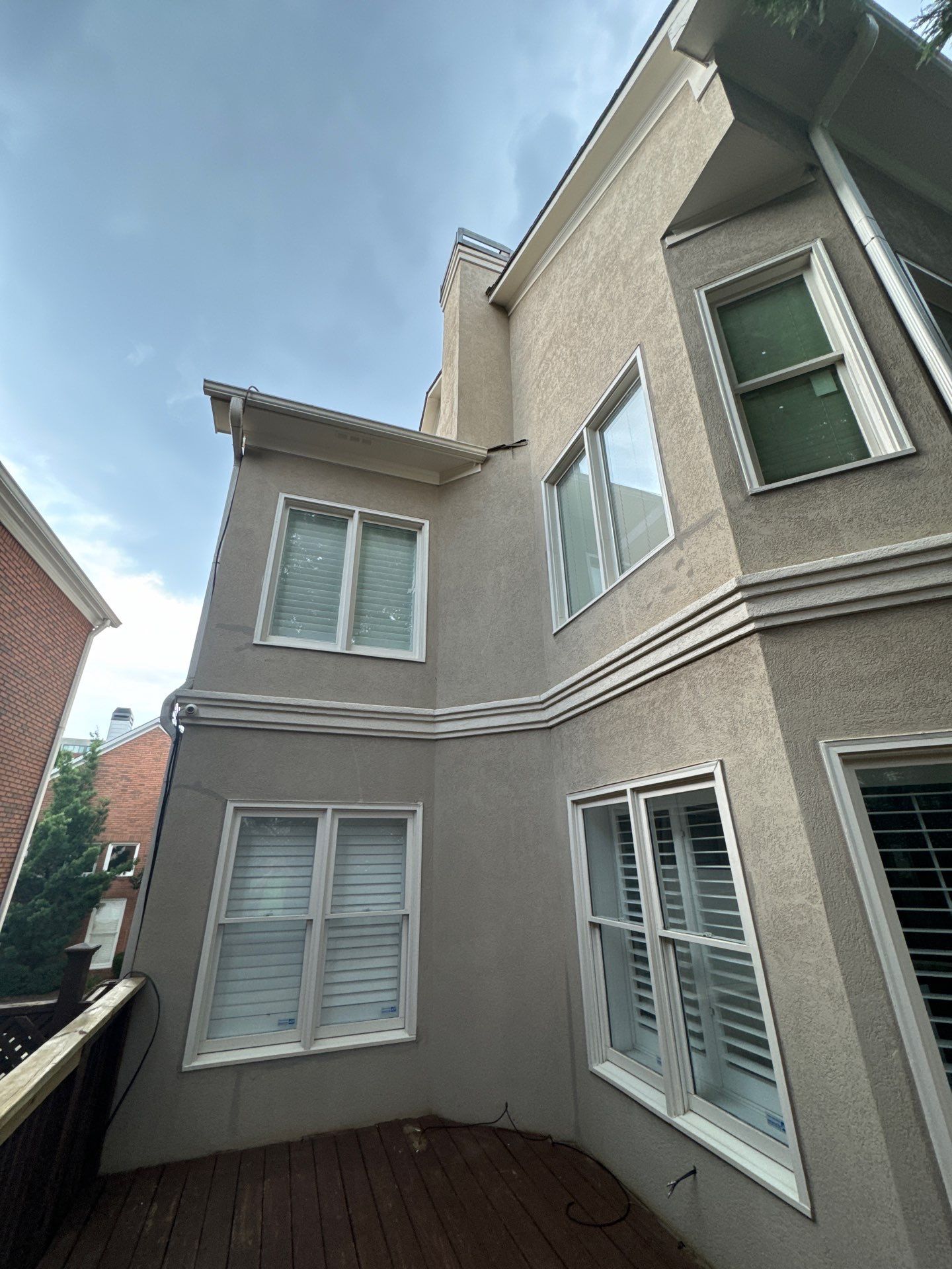 Full Exterior Stucco Painting and Wood Deck Staining in Atlanta by Swift Home Renovations