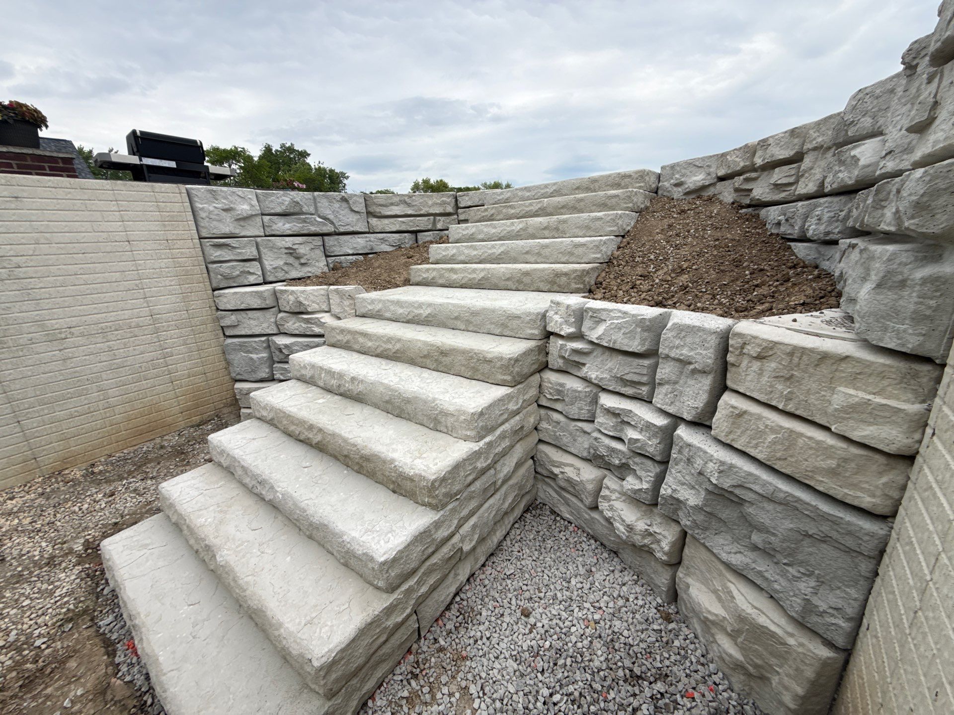 Basement Walkout Construction with Tiered Retaining Walls in Berkey by Farrell's Lawn & Garden Center LLC
