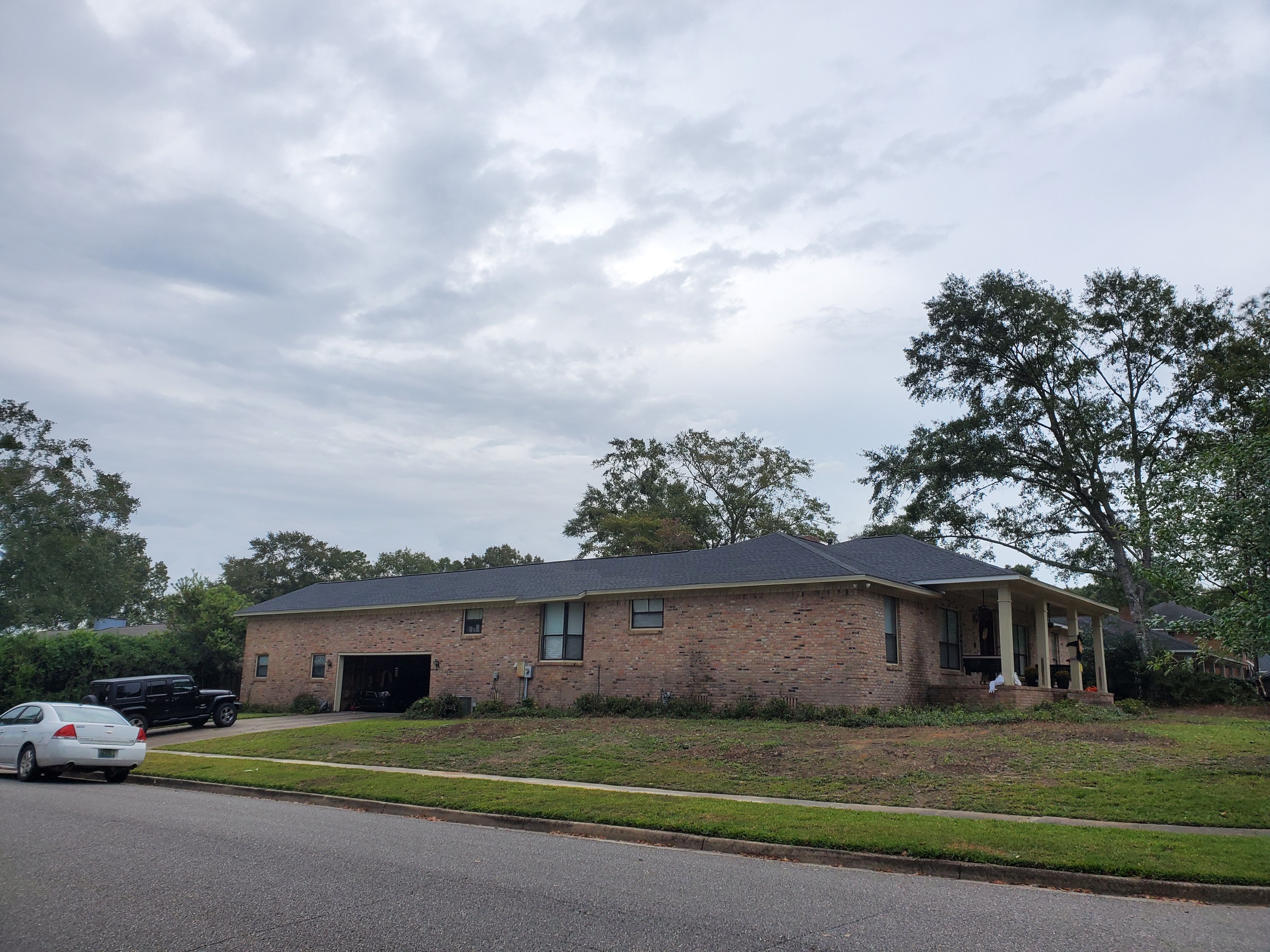 Residential Roofing Installation using Roof Replacement by American Roofing & Construction LLC