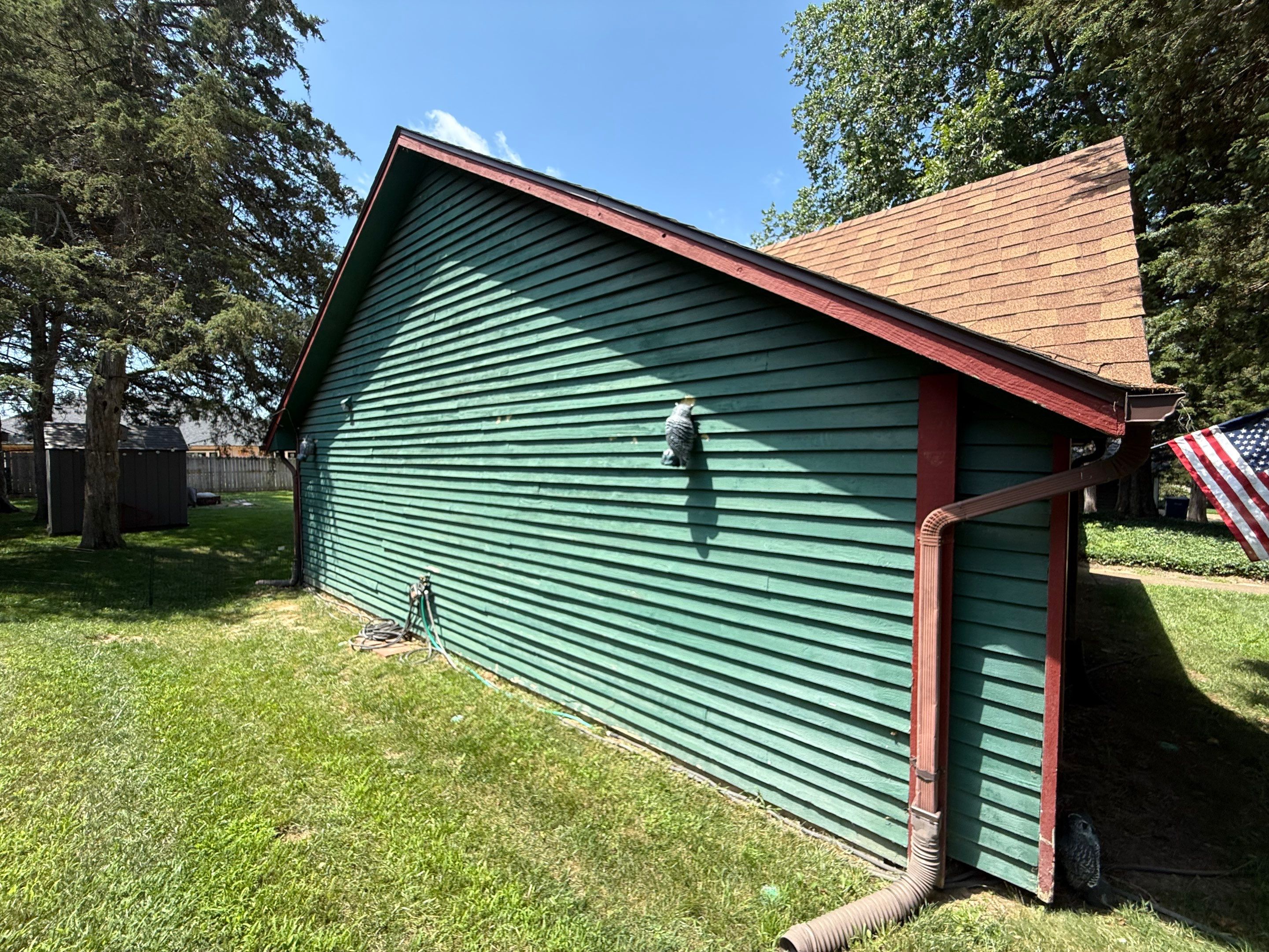 Wood siding refresh by Pezley Painting
