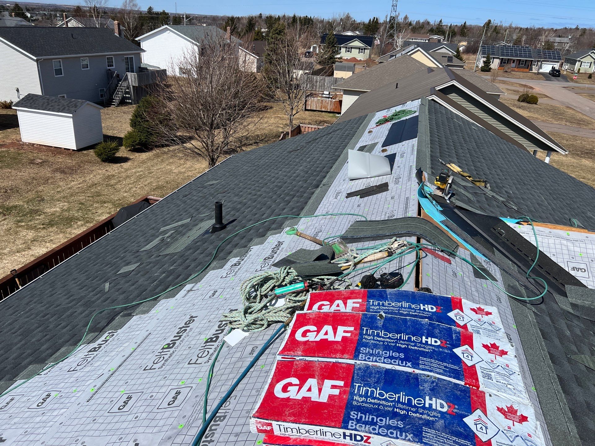 Residential Roofing Installation using Asphalt GAF HDZ in Charcoal by Artisan Roofing & Home Improvements Inc.