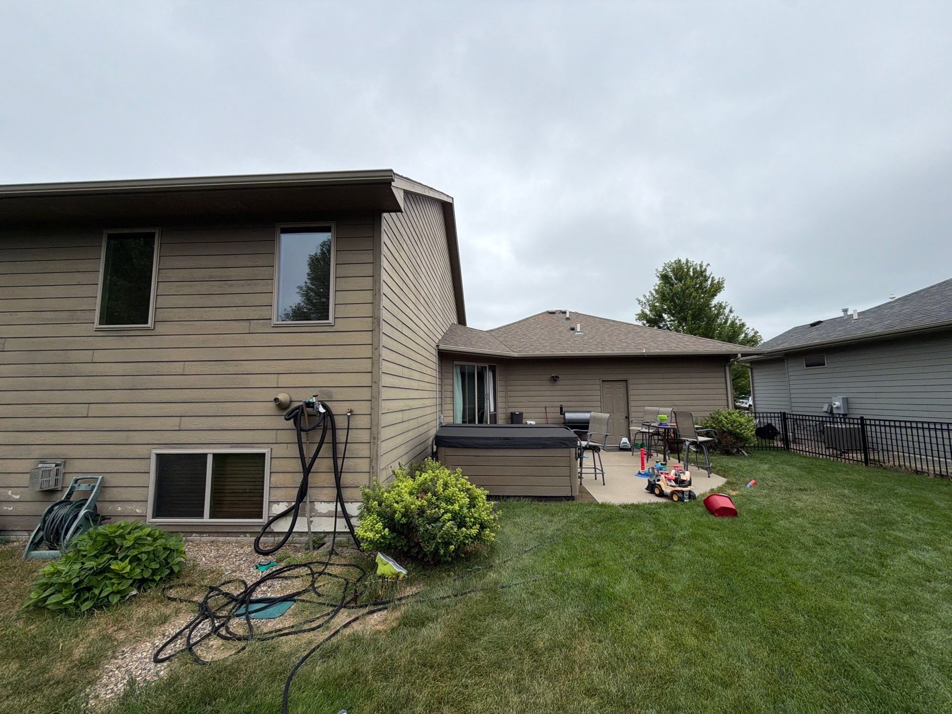 Full Exterior Siding Repaint for Sioux Falls Home and Garage by Select Painting, Coatings & Garage Cabinets