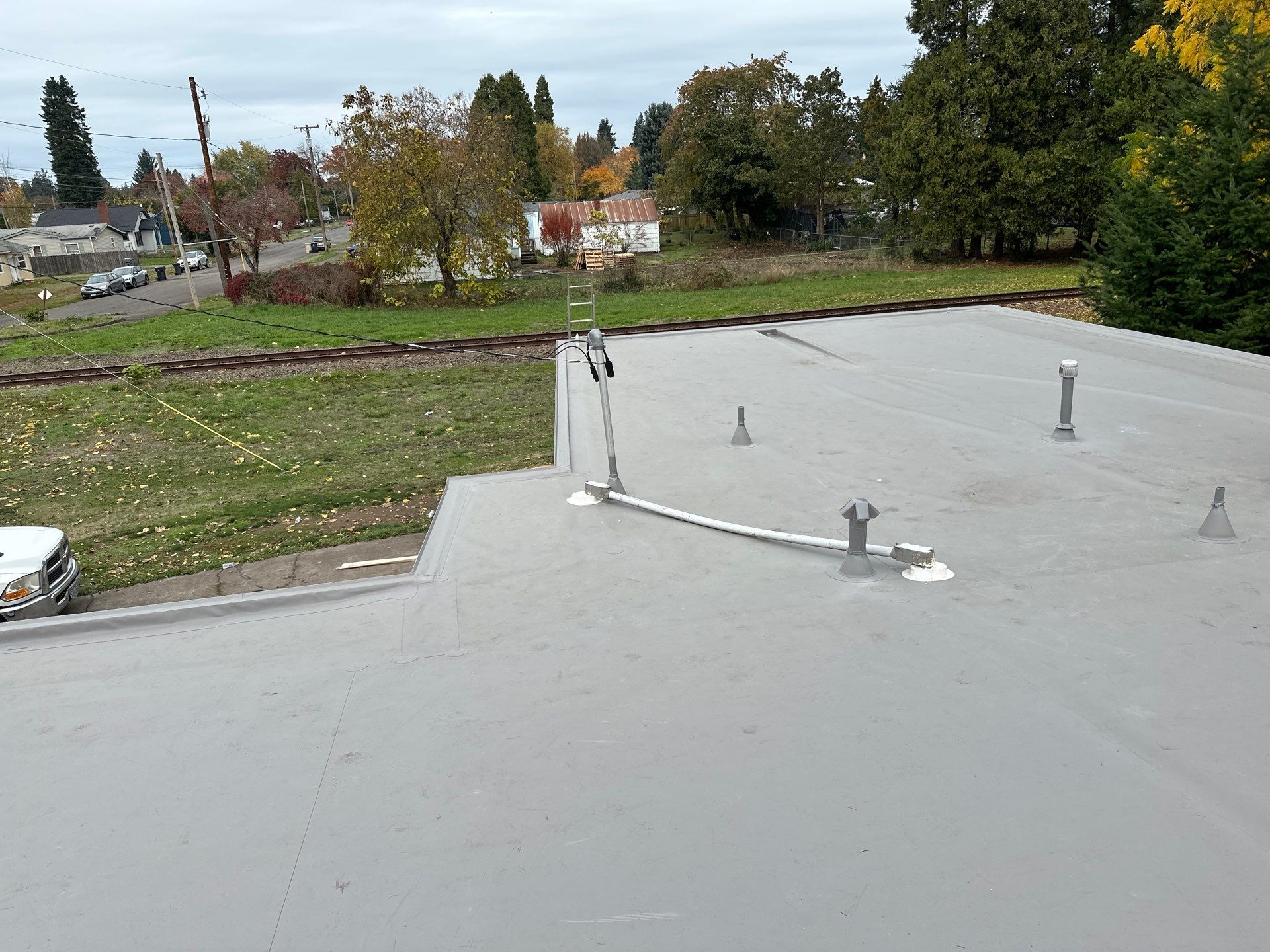 Residential Membrane Roof Replacement by Orezona Building & Roofing Company, Inc.