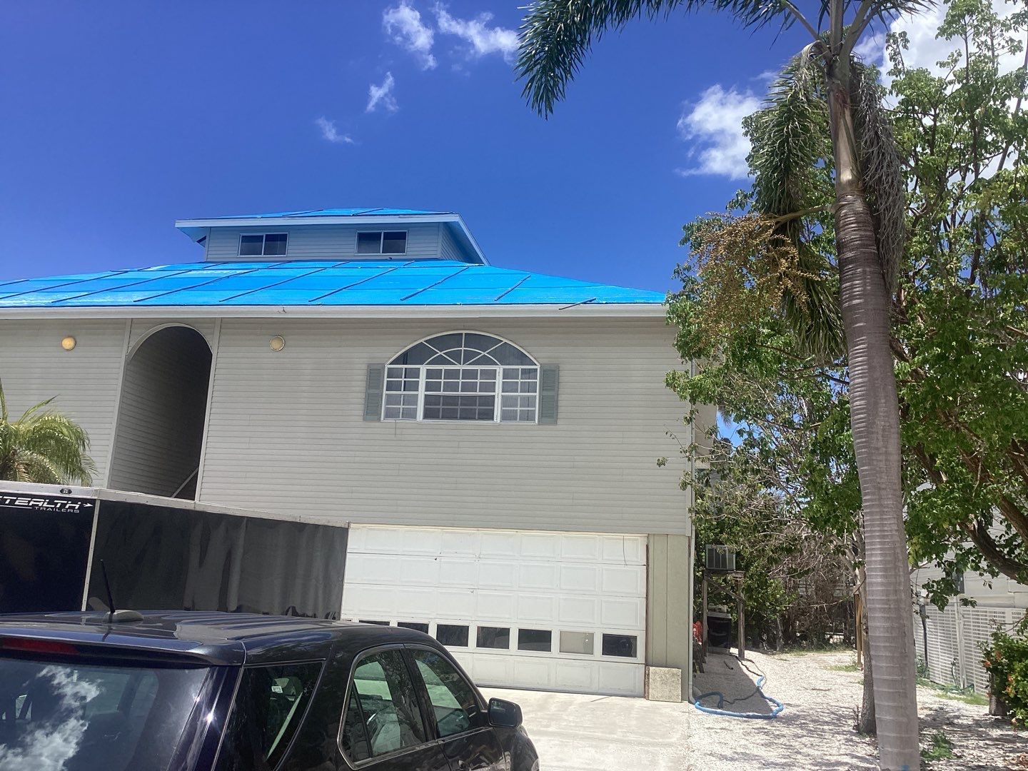 Complete Gutter System with Downspouts & Guards in Fort Myers Beach FL by Gutter Professors