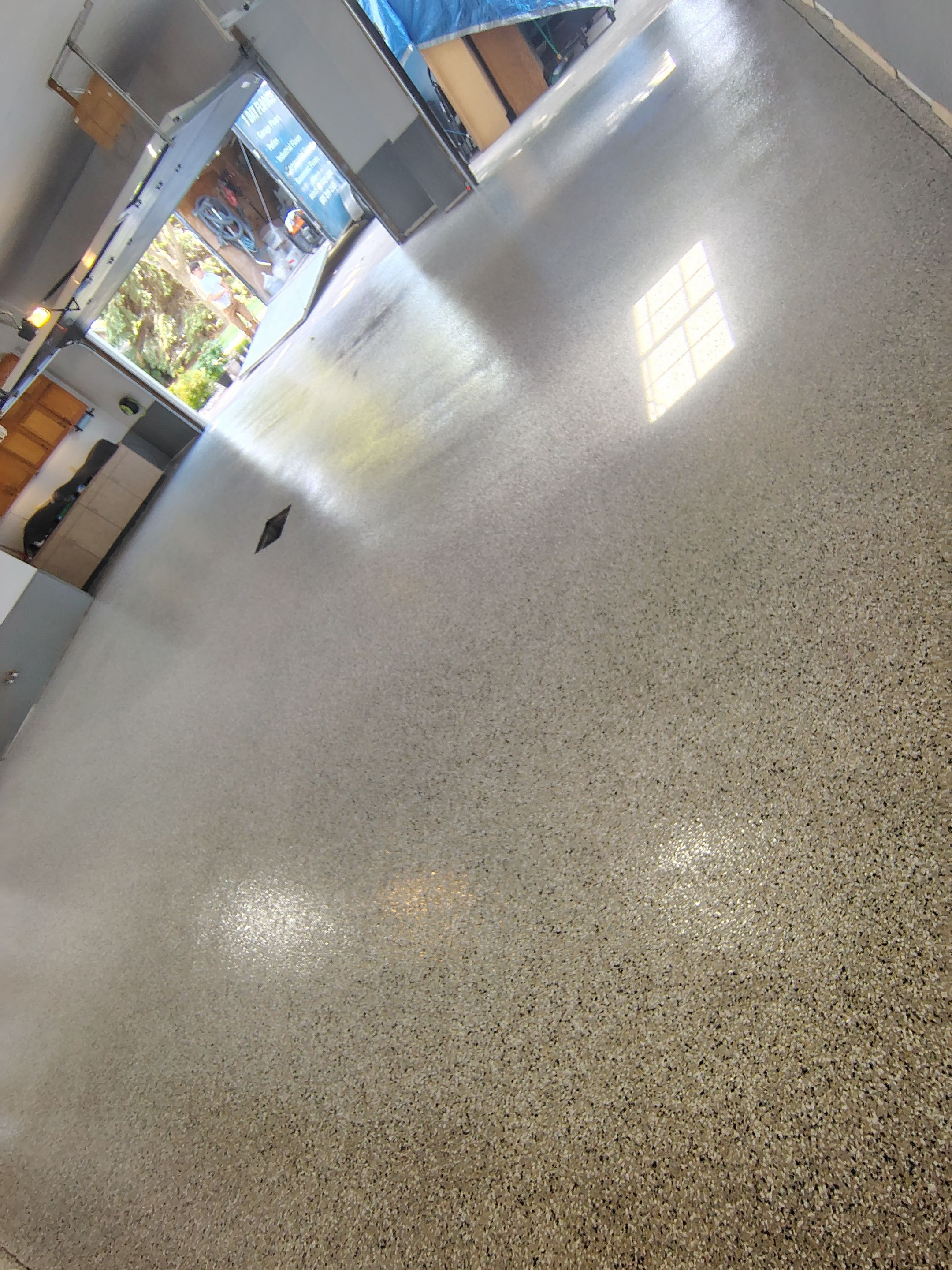 Multi-Fleck Epoxy Garage Floor Coating in Dell Rapids by Select Painting, Coatings & Garage Cabinets
