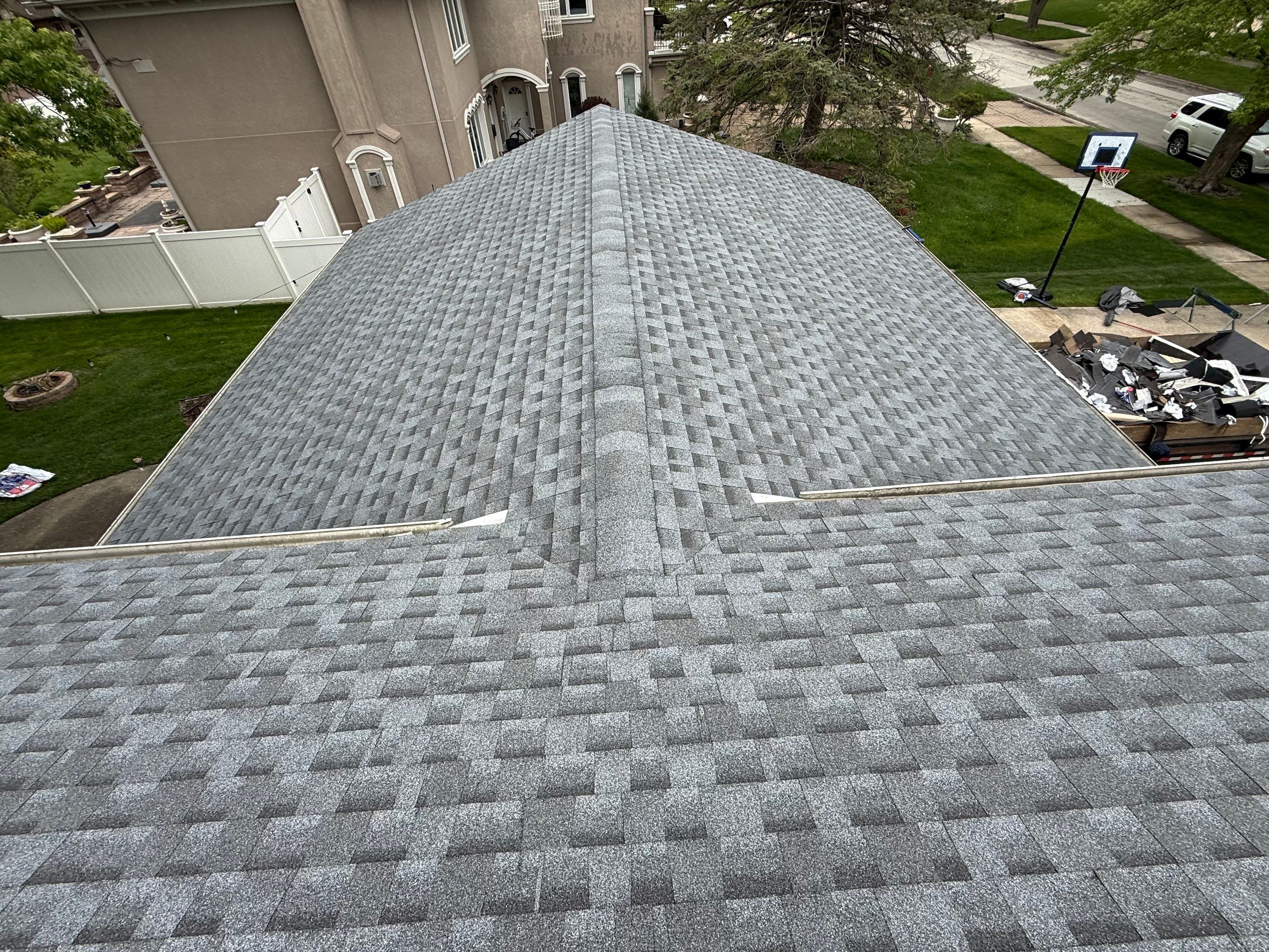 Roof replacement and chimney flashing by Optimal Home Improvement 