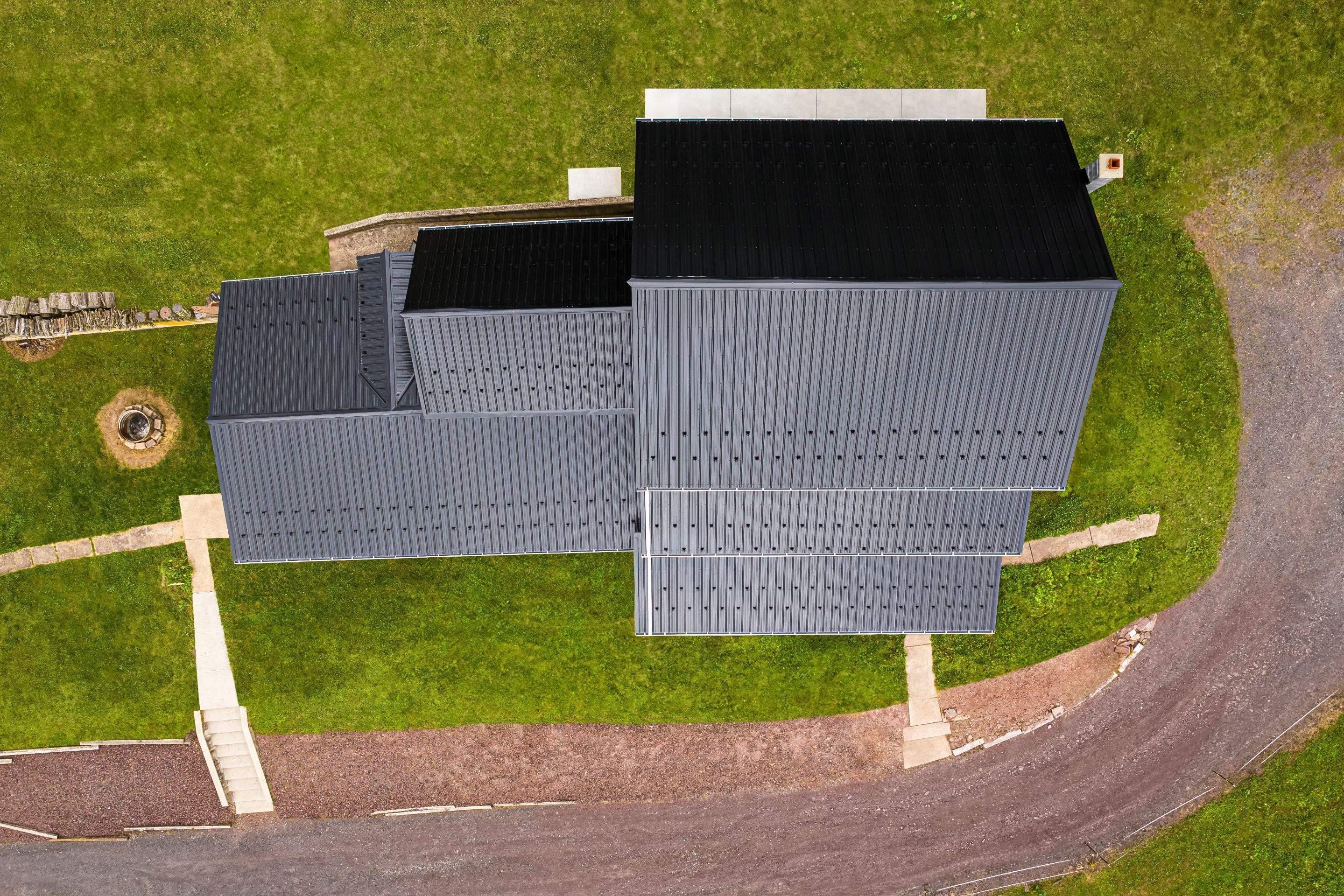 New Metal roof and New siding by Esh Builders