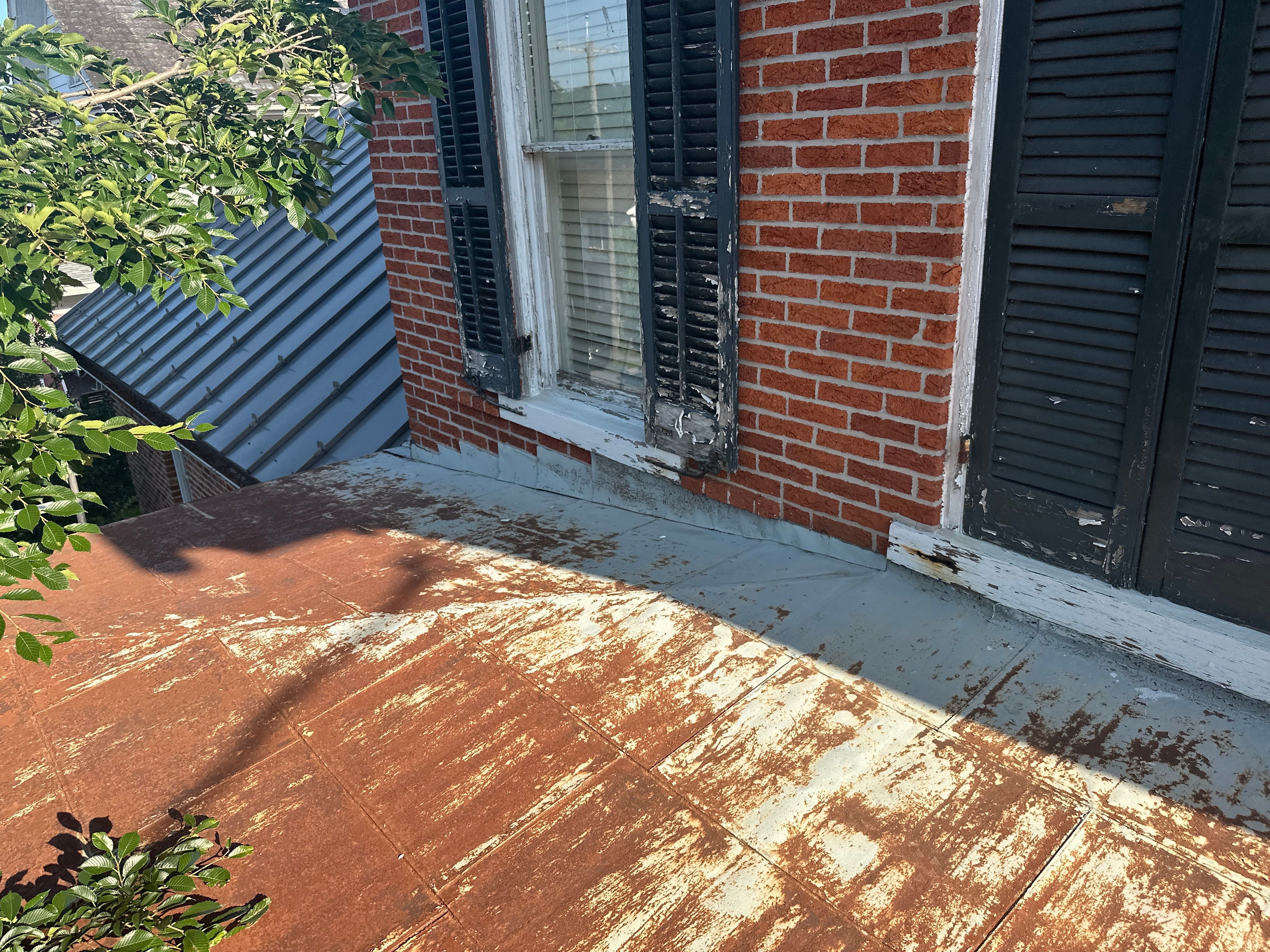 Updated Porch Roof with Clean Standing Seam Lines by Esh Builders