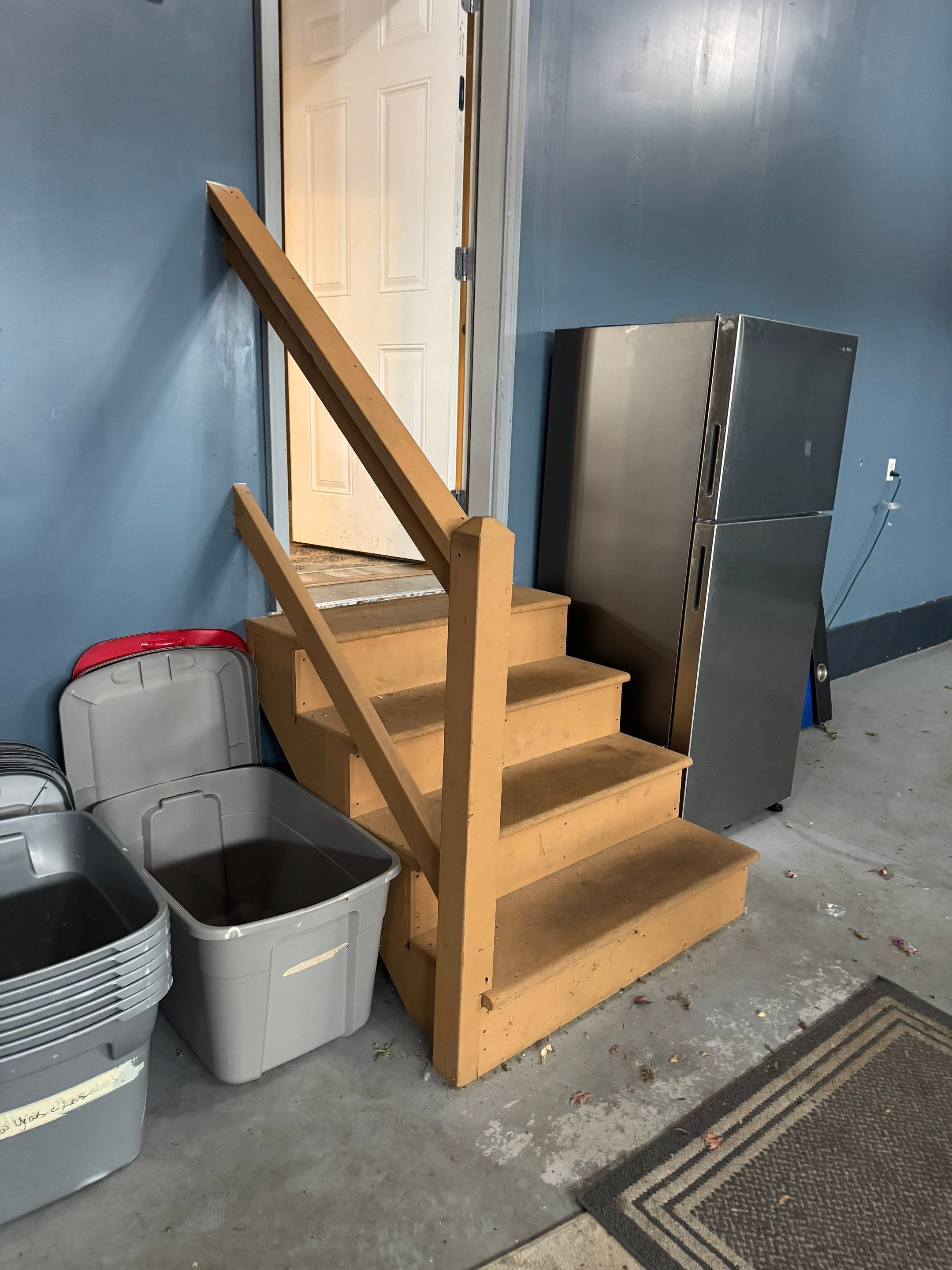 Grey Speckled Epoxy Garage Floor and Stair Coating in Sioux Falls by Select Painting, Coatings & Garage Cabinets