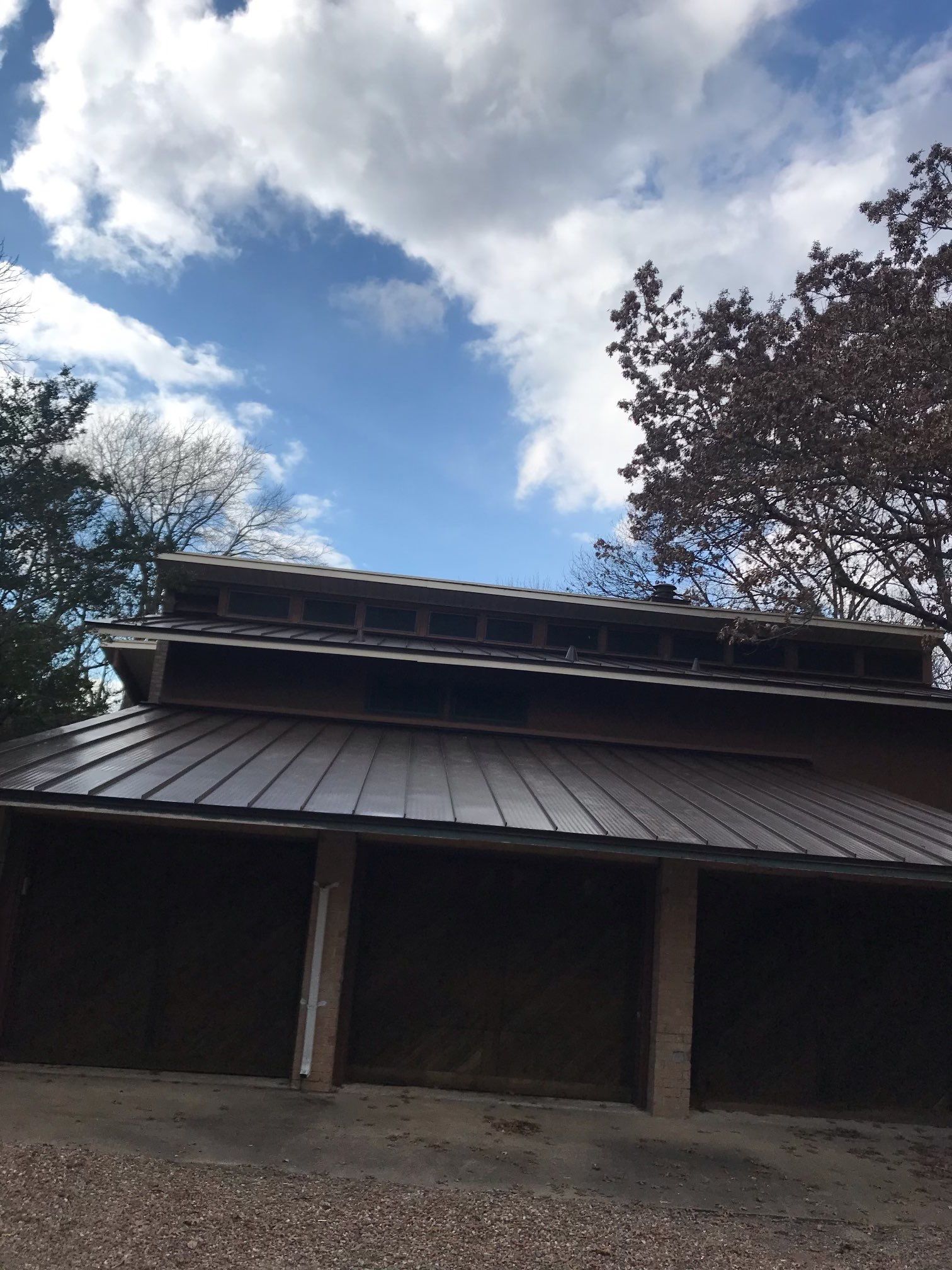 Residential Roofing Installation using Standing Seam Metal Roofing and Composition Shingles by Rainy Day Restoration